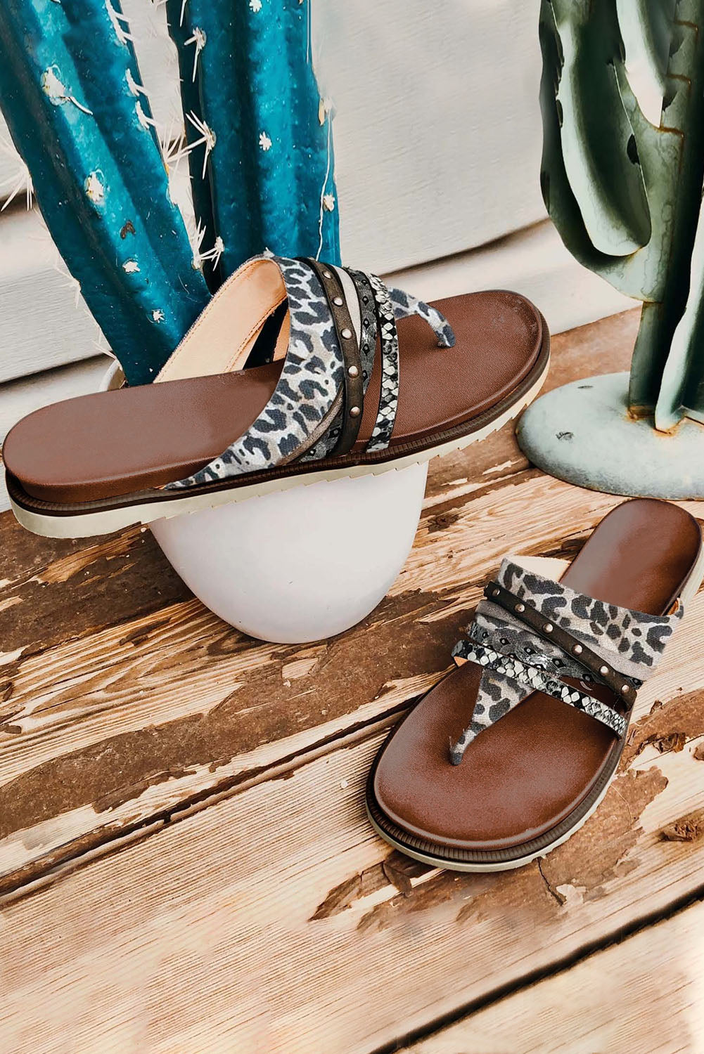 Leopard studded animal print flip flop sandals showcasing unique design and comfortable fit.