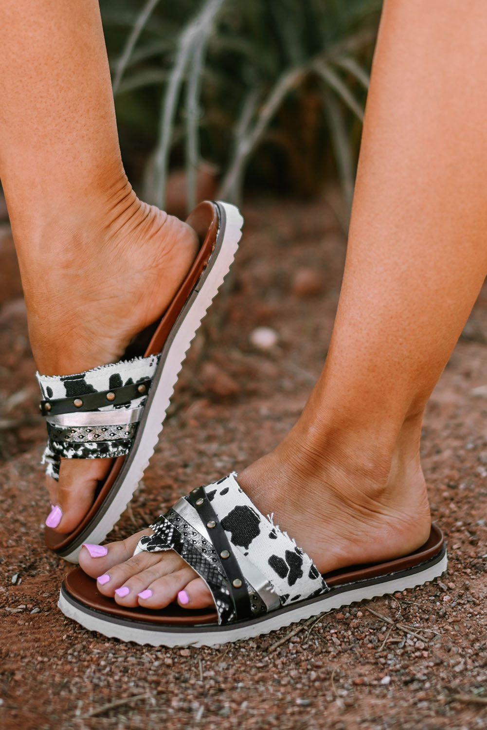 Leopard studded animal print flip flop sandals showcasing unique design and comfortable fit.