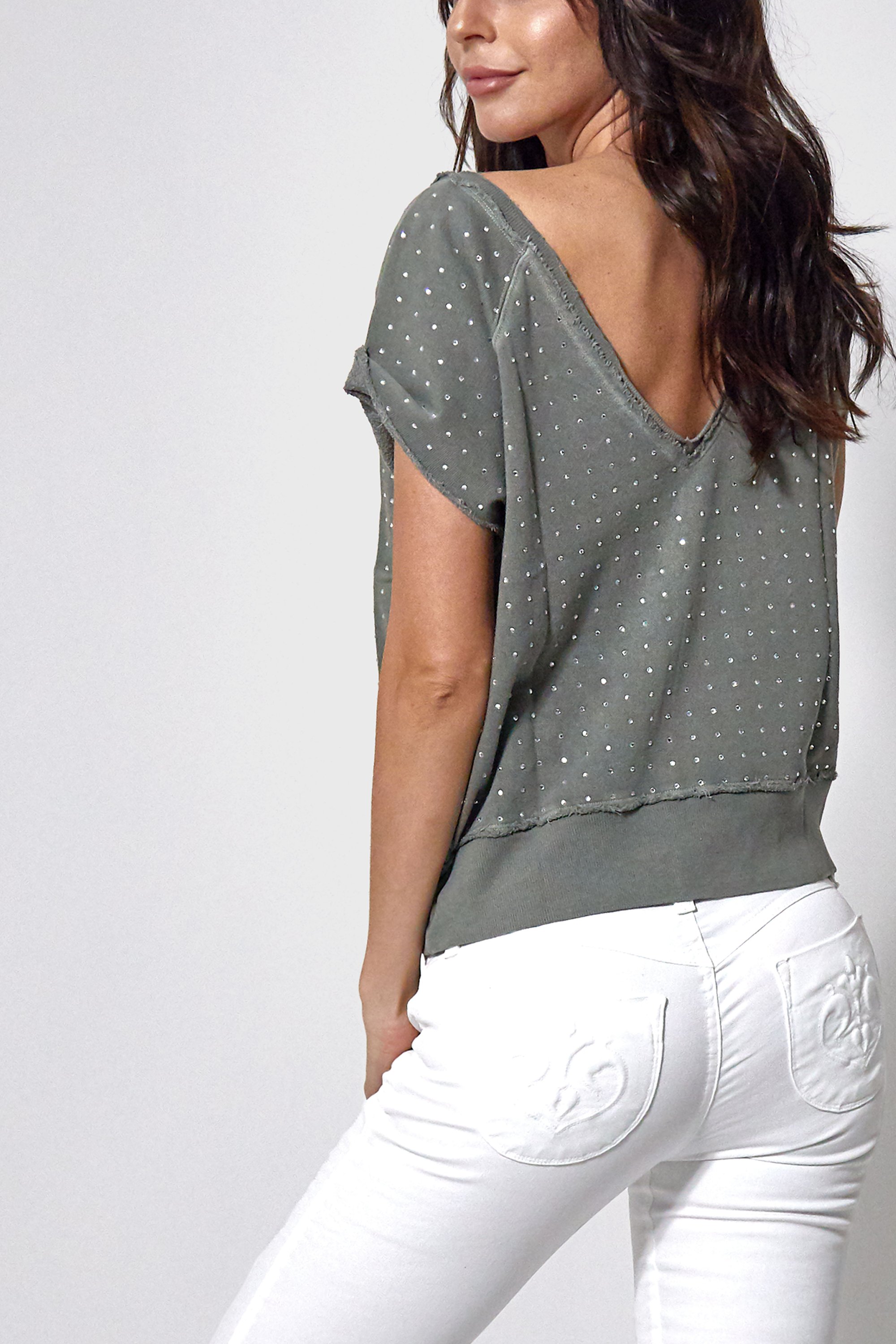 Lexi Pullover in Army Green featuring a relaxed fit and open back design, made from 100% cotton.