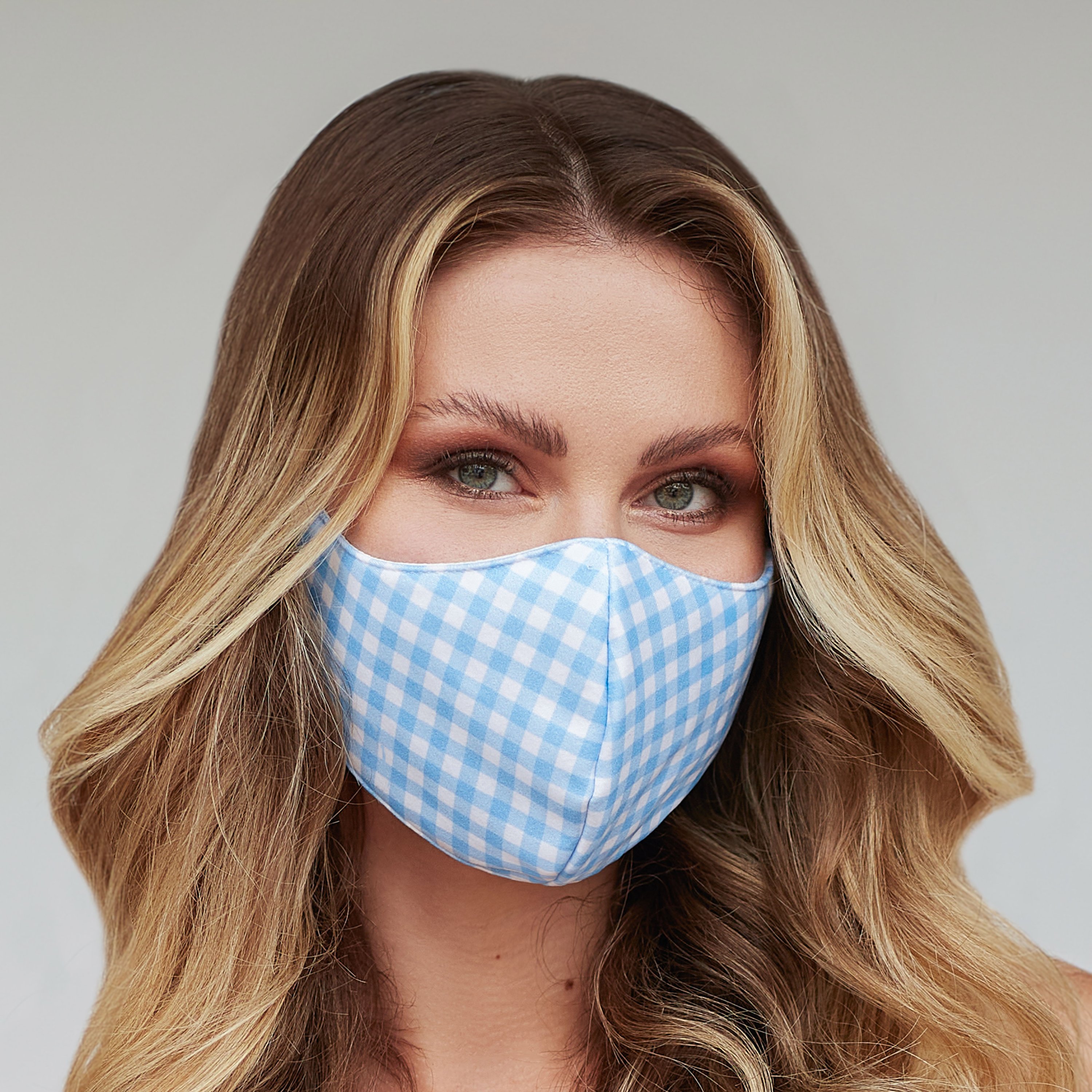 Light Blue Gingham Face Mask featuring a stylish pattern, made of breathable cotton and polyester layers, suitable for various outdoor activities.