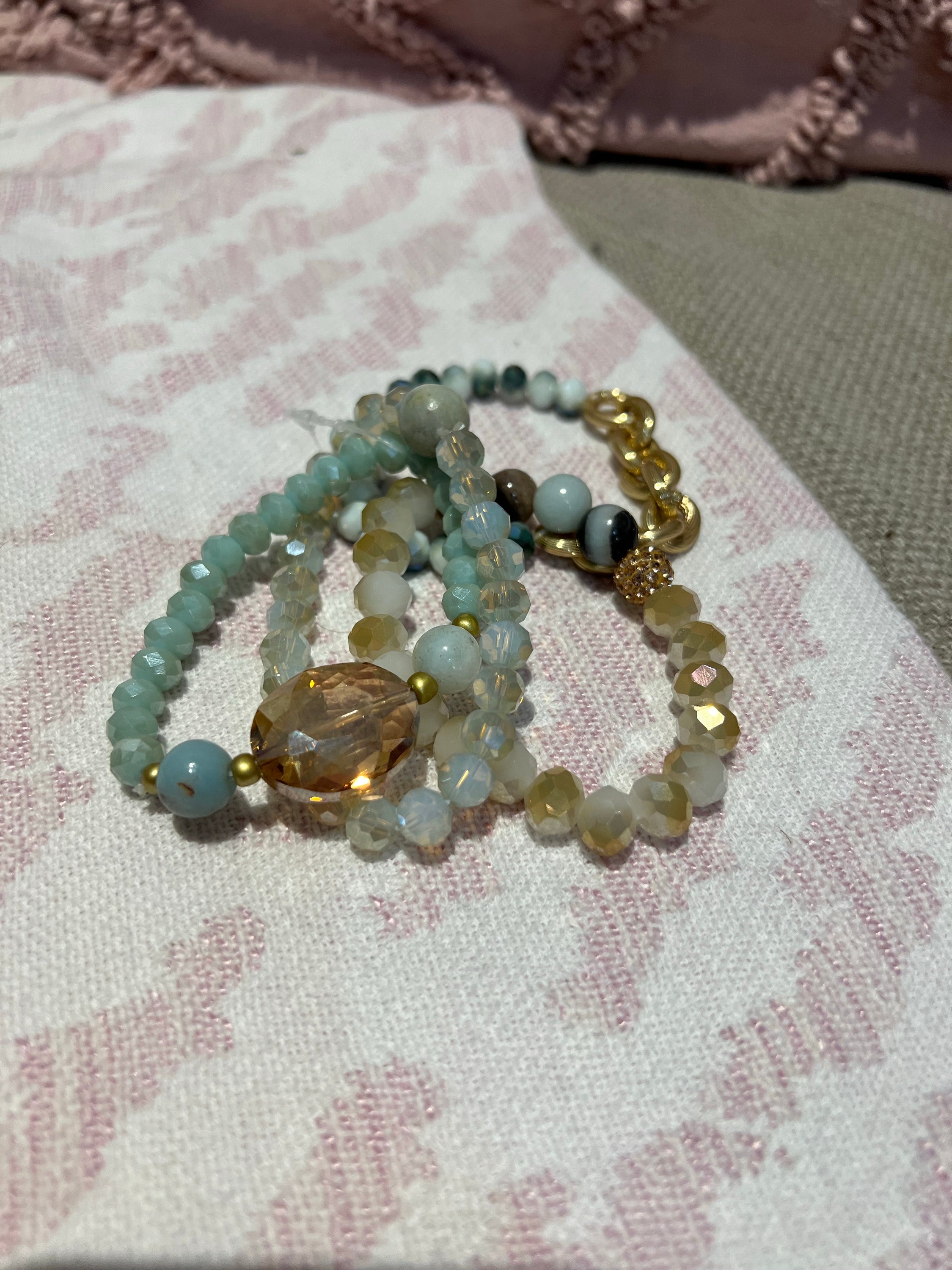A set of five light turquoise elastic bead bracelets displayed elegantly, showcasing their vibrant color and stylish design.