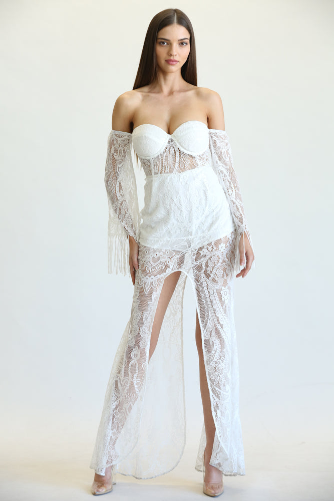 Lilah Dress featuring boho pattern lace fabric, off-shoulder design, and bell sleeves with fringe.