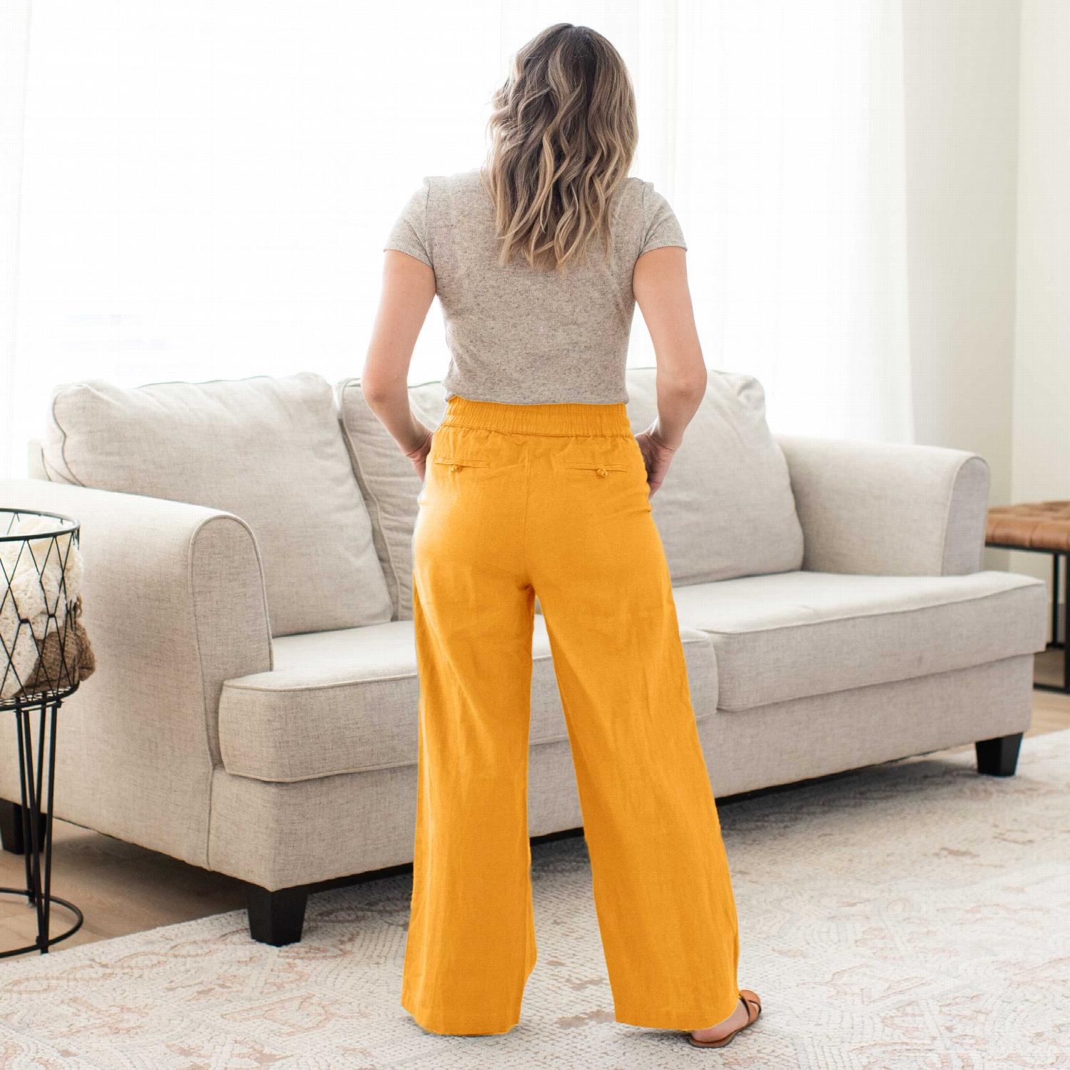 Linen drawstring-waist pants with pockets, showcasing a relaxed fit and stylish design, perfect for casual and work outfits.