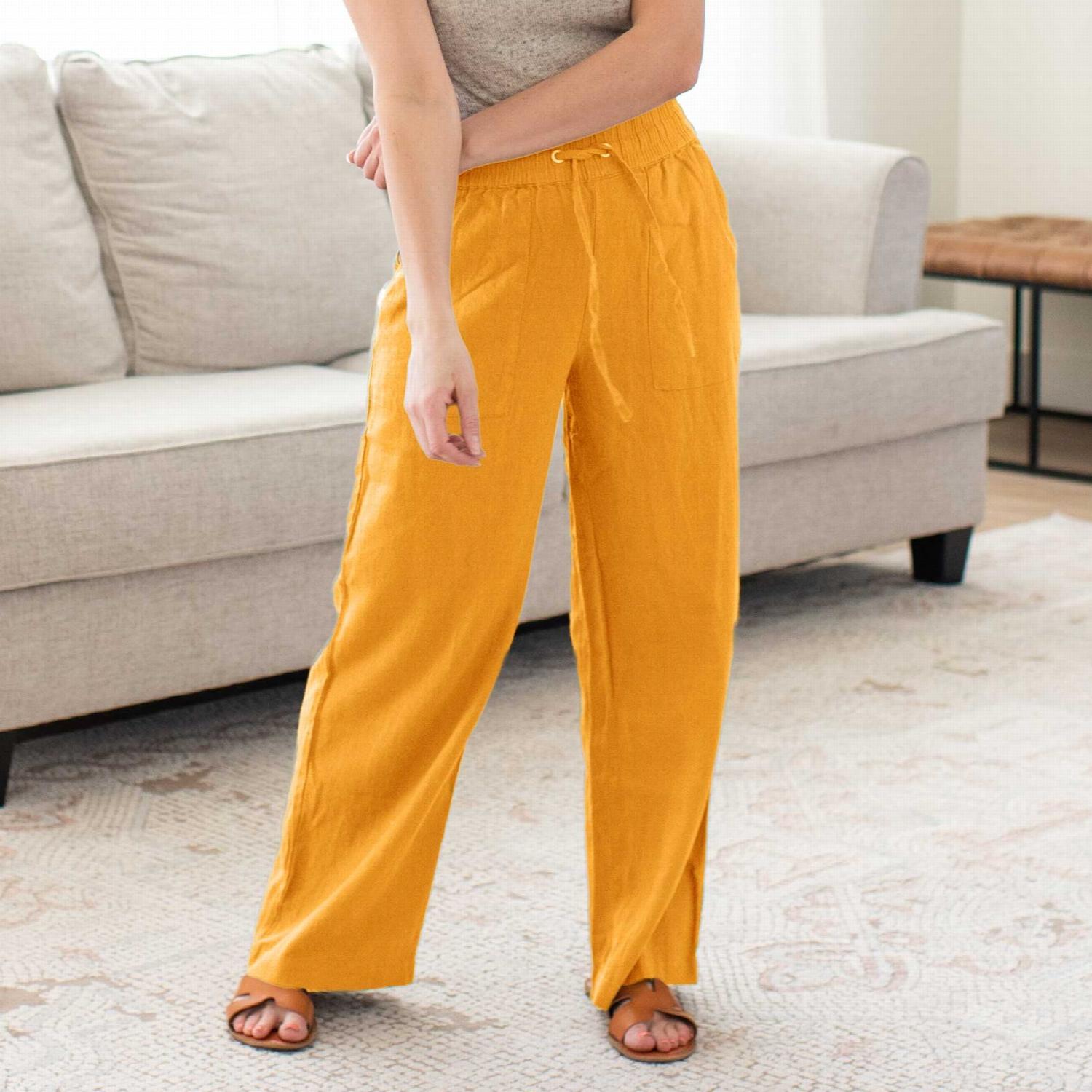 Linen drawstring-waist pants with pockets, showcasing a relaxed fit and stylish design, perfect for casual and work outfits.