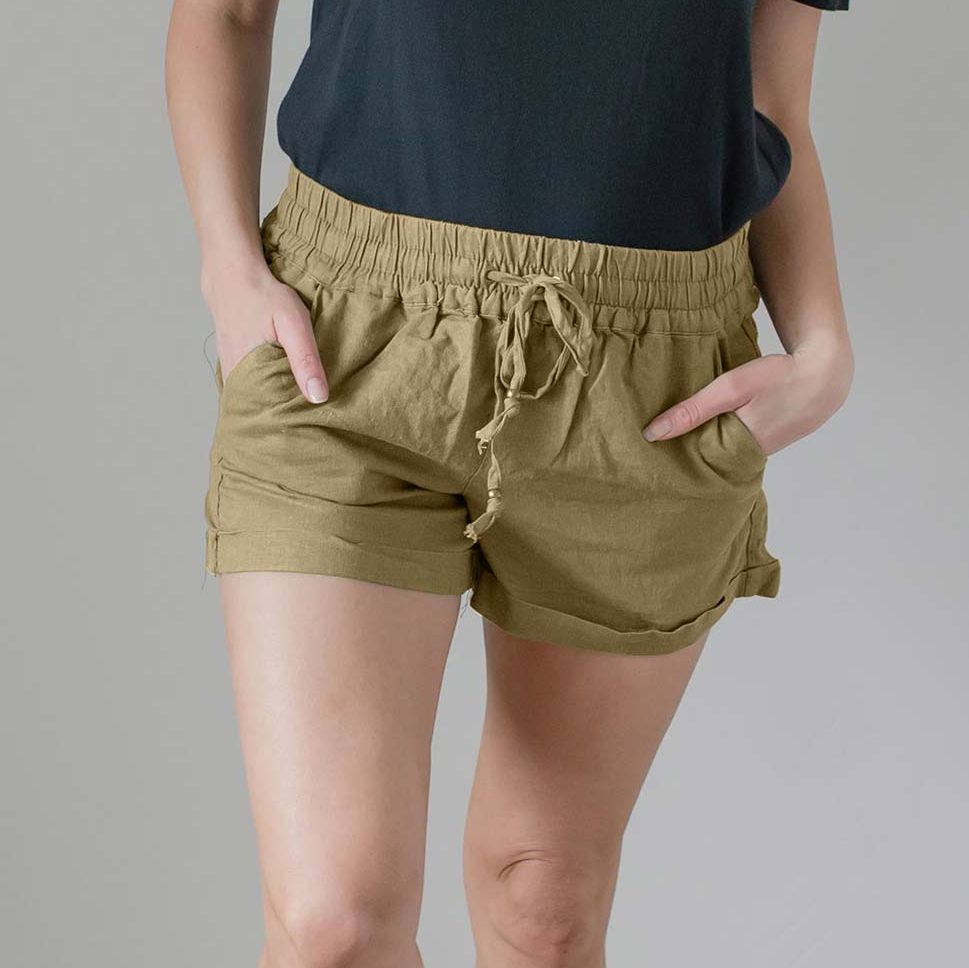 A pair of stylish linen drawstring-waist shorts with pockets, featuring cuffs at the leg openings, displayed in a vibrant color.