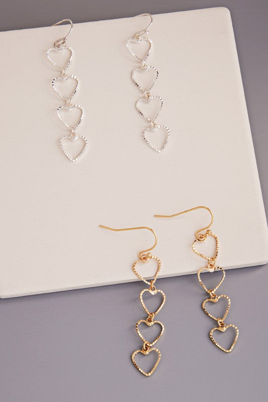 Linked Hearts Brass Dangle Earrings with a 2.25-inch drop length, showcasing a romantic linked hearts design.