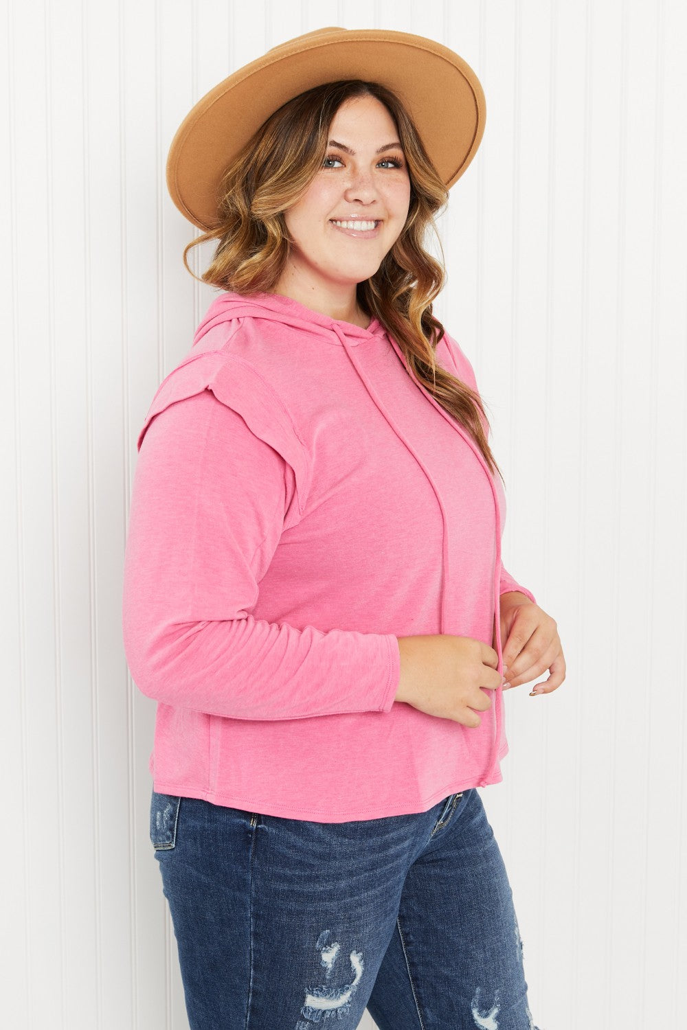 Live Simply Full Size Shoulder Detail Knit Hoodie in a studio setting, showcasing its stylish shoulder details and lightweight fabric.