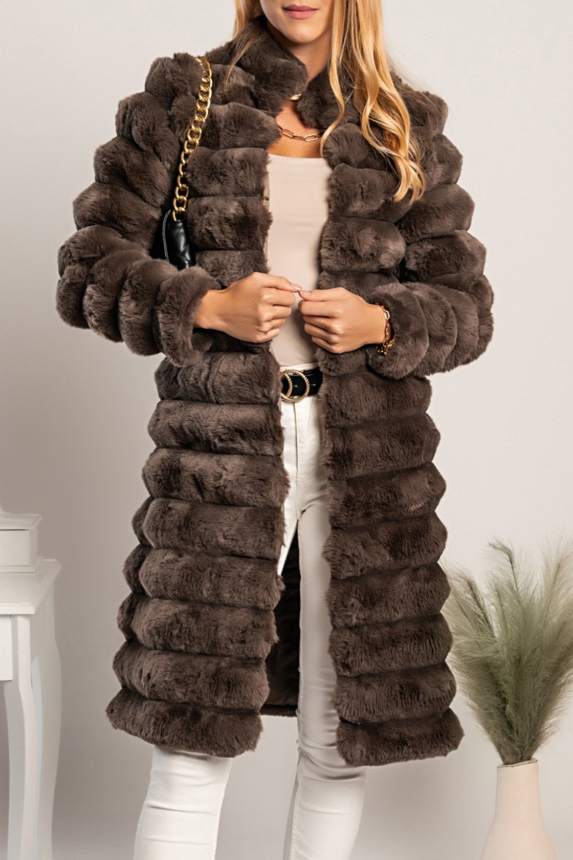 Long elegant brown faux fur coat by Benimia with stand-up collar and front pockets.