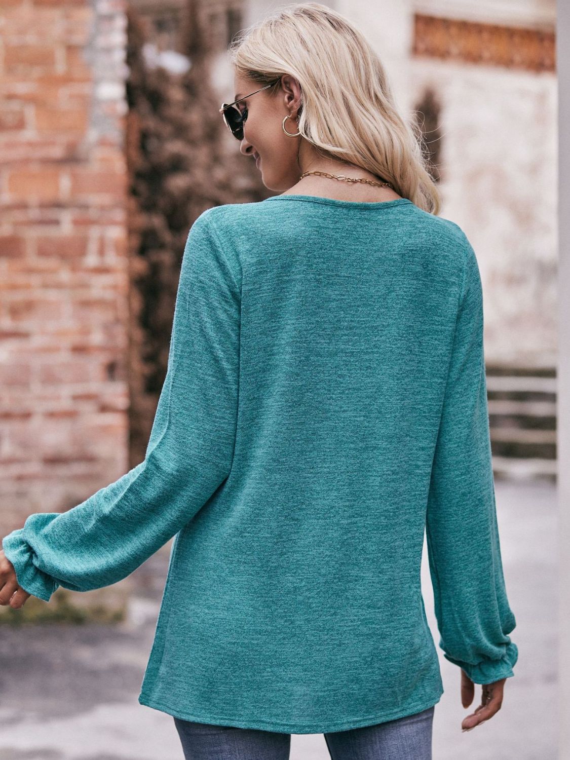 A stylish Long Flounce Sleeve Round Neck Blouse in solid color, featuring elegant flounce sleeves and a comfortable round neckline.
