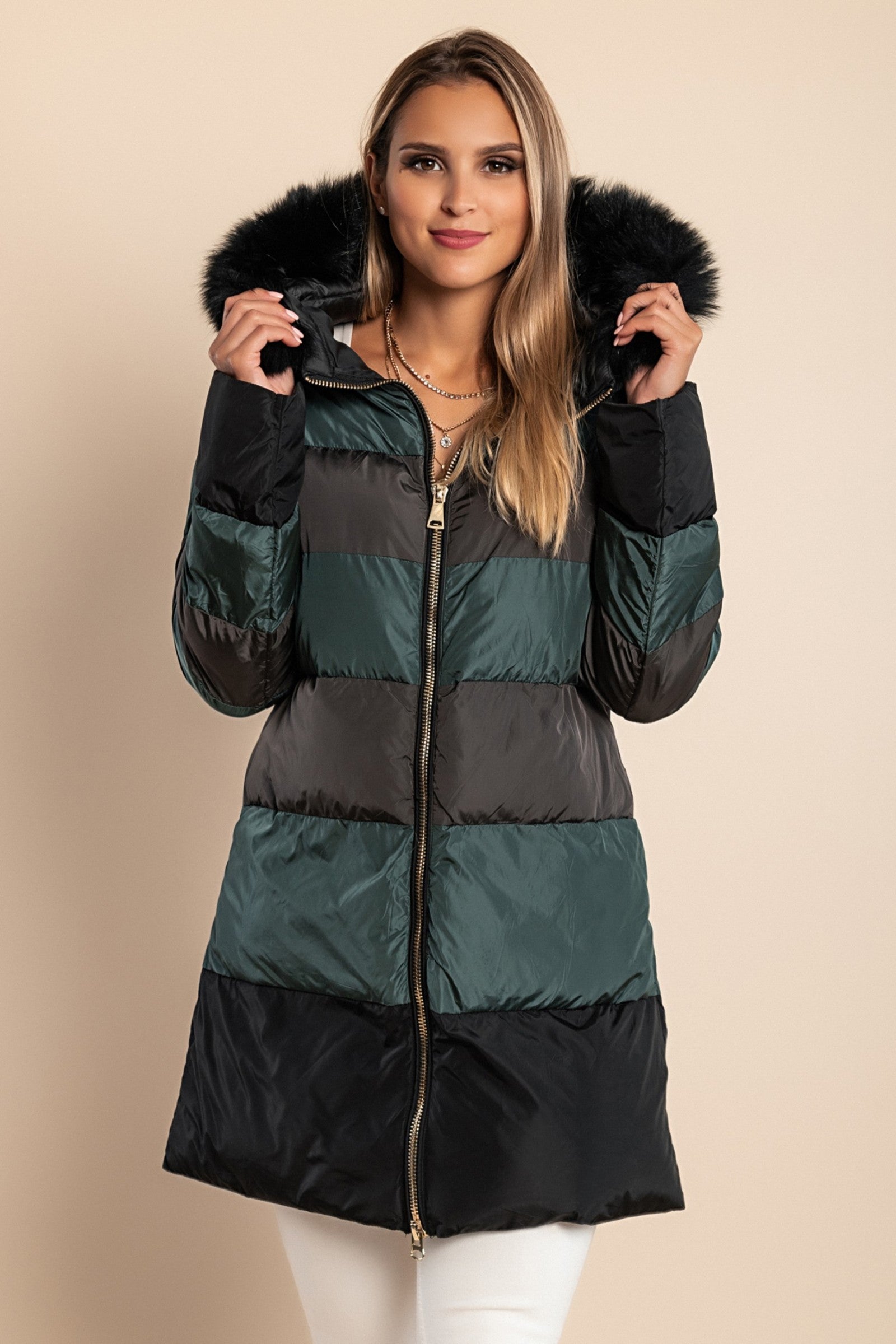 Long petrol jacket with hood and faux fur trim, featuring a high collar and zip closure, perfect for cold weather.