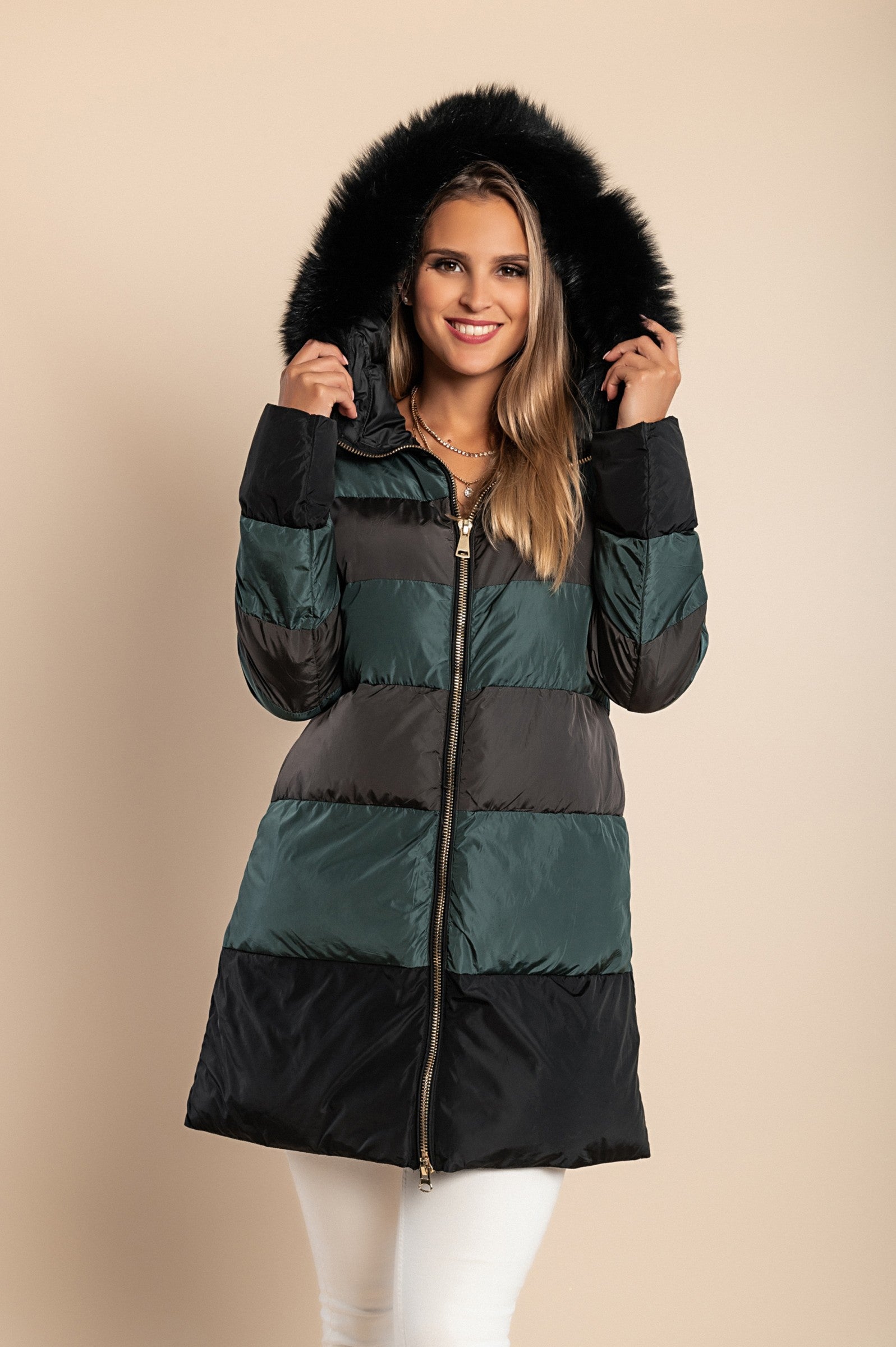 Long petrol jacket with hood and faux fur trim, featuring a high collar and zip closure, perfect for cold weather.