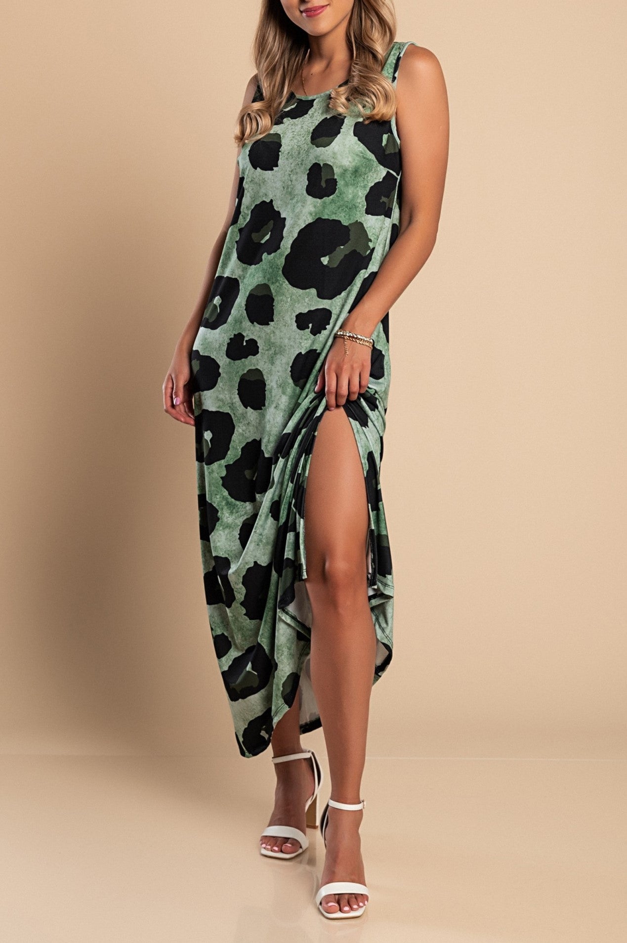 Elegant long green leopard print dress with round neckline and side slit, made from lightweight fabric.