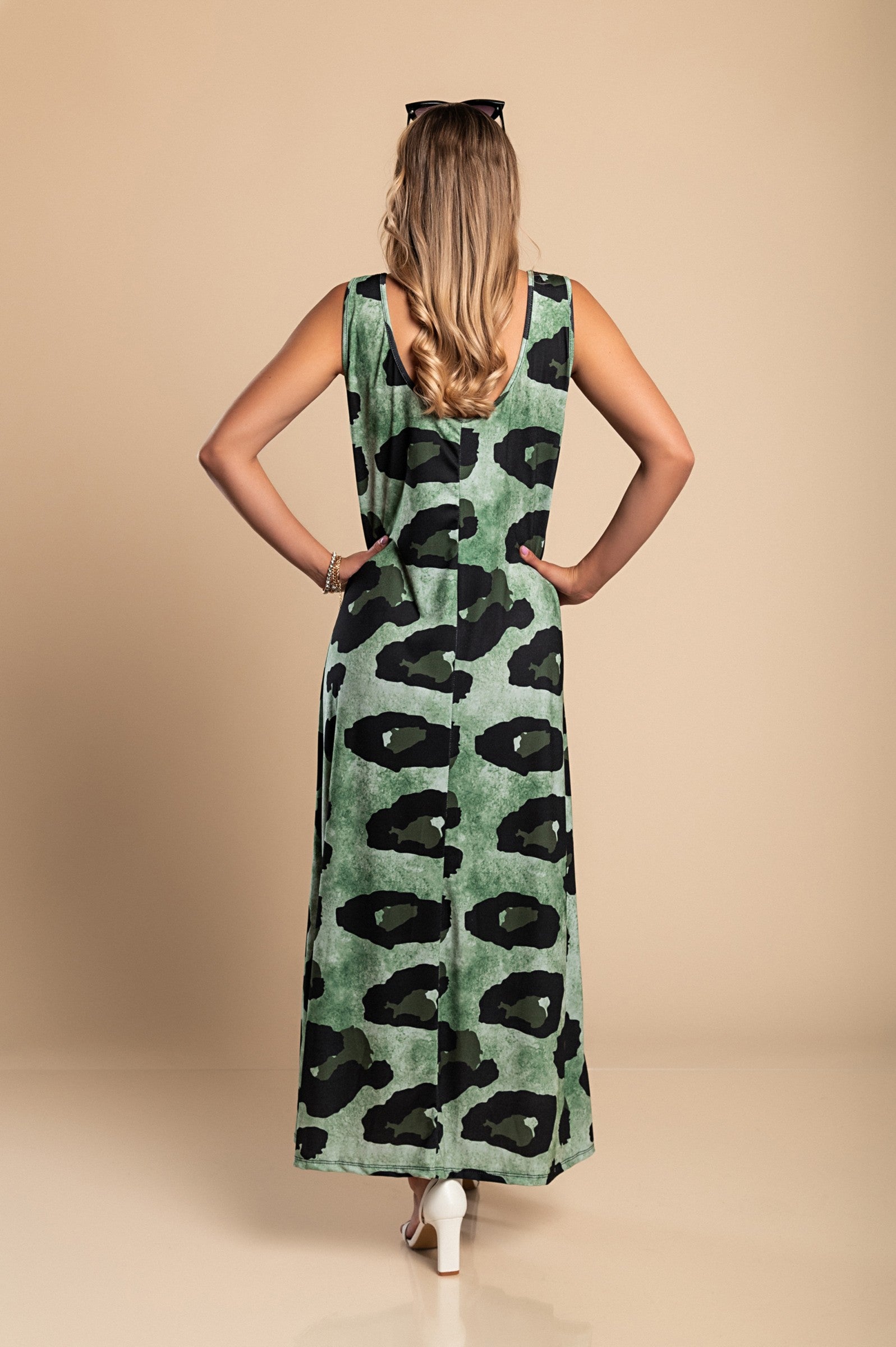 Elegant long green leopard print dress with round neckline and side slit, made from lightweight fabric.