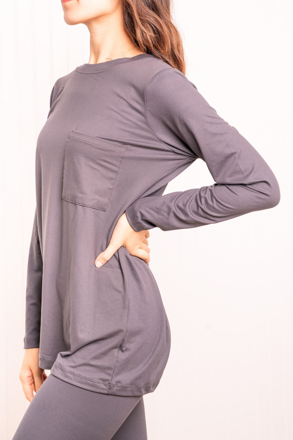 Long Sleeve Top and Leggings Loungewear Set in Ash Grey displayed on a mannequin, showcasing its minimalist design and soft fabric.