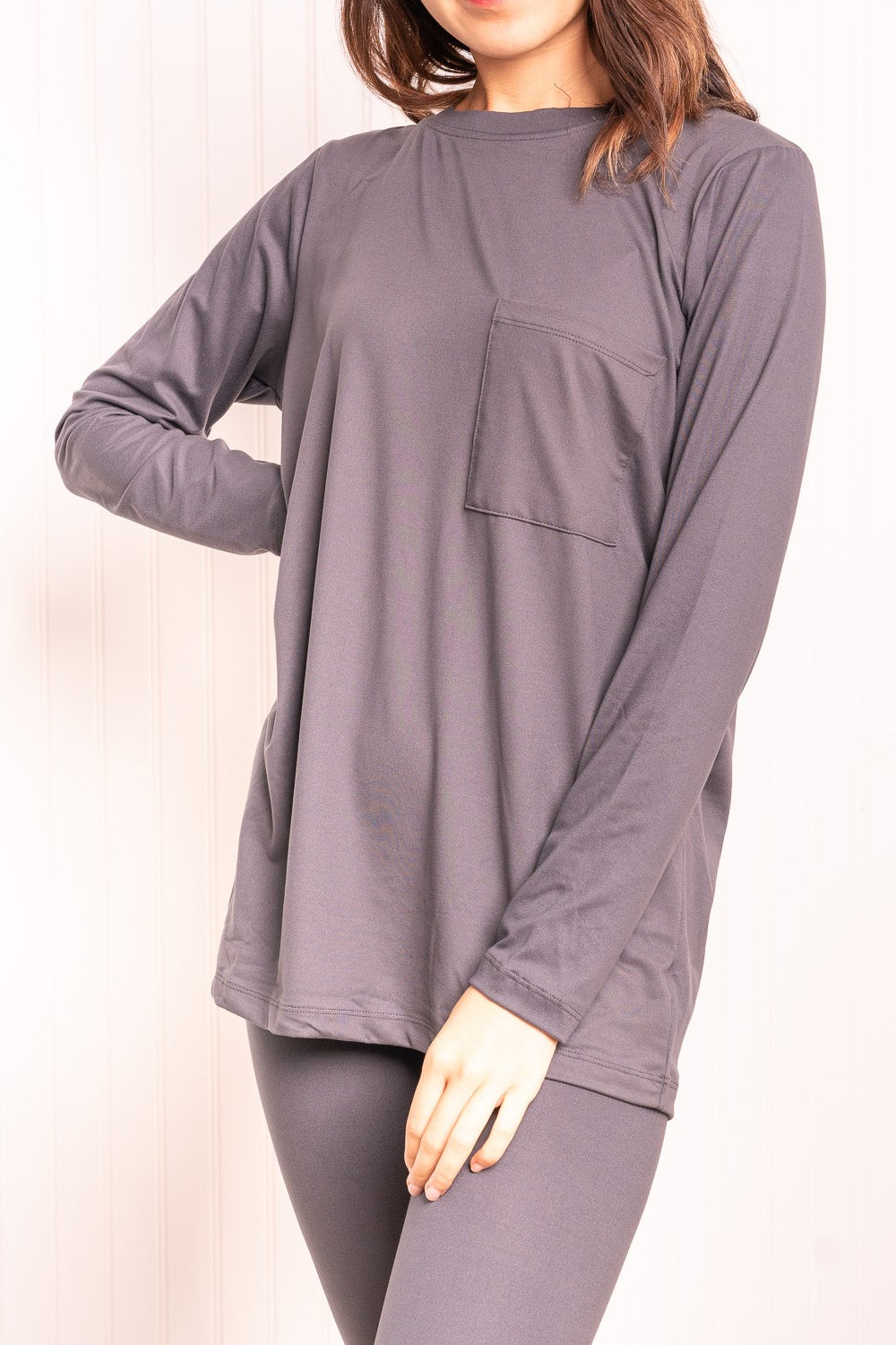 Long Sleeve Top and Leggings Loungewear Set in Ash Grey displayed on a mannequin, showcasing its minimalist design and soft fabric.
