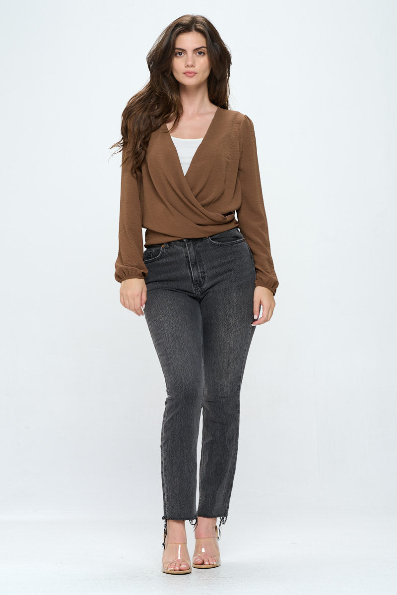 A stylish Long Sleeve Wrap Top featuring a draped front and adjustable waist tie, made from breathable fabric.