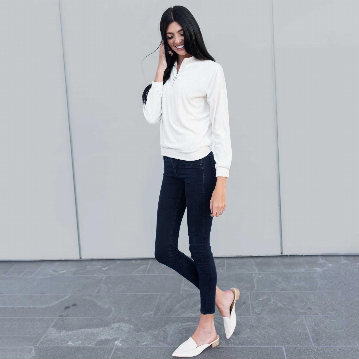 A cozy Long Sleeved Fleece Front Zipper Jacket in a solid tone, featuring a front zipper and soft fabric, perfect for fall layering.