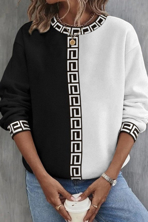 Loose Top with geometric print in white, featuring a round neckline and long sleeves, designed for comfort and style.