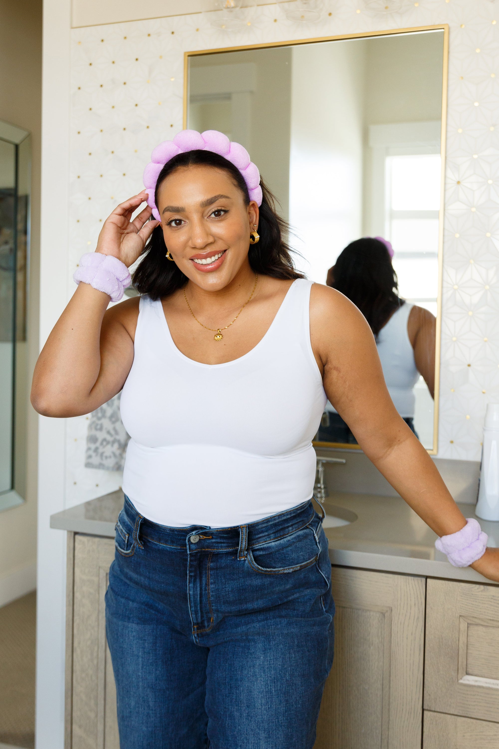 Purple braided sponge headband and matching wristbands made of absorbent terrycloth, ideal for skincare routines.