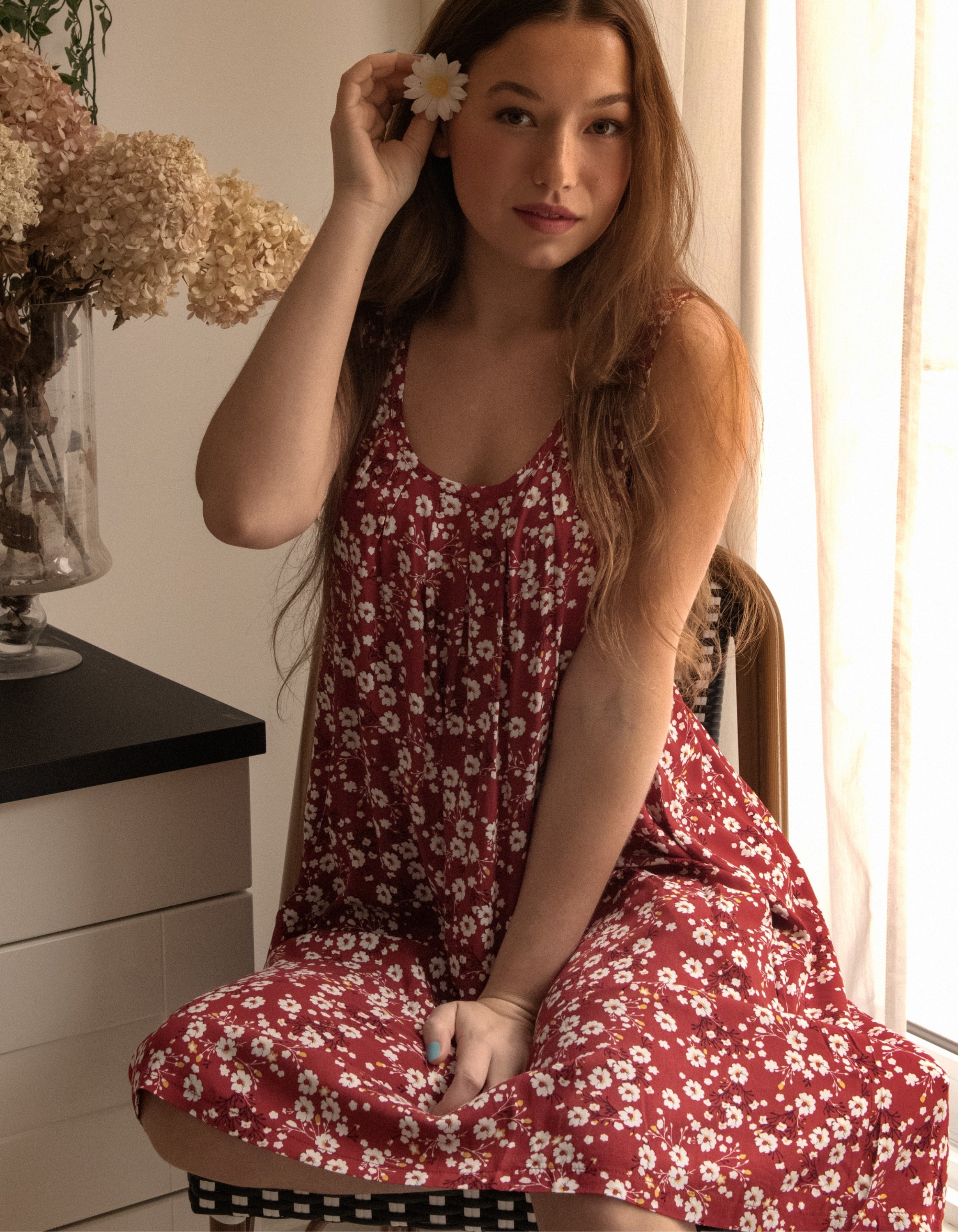 Louise Short Dress featuring a ditsy floral print in Navy, Red, and Green, showcasing a flattering A-line silhouette and side pockets.