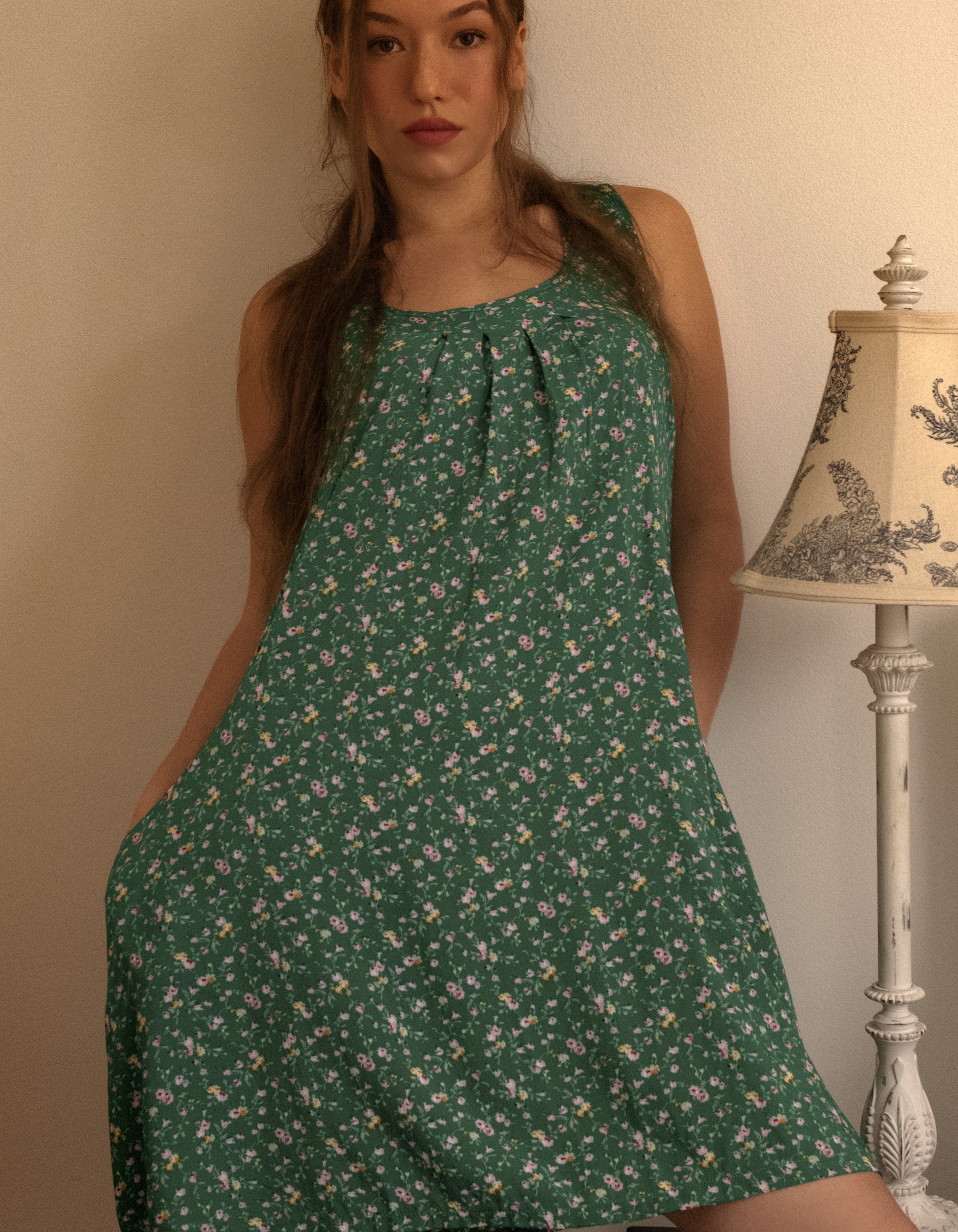 Louise Short Dress featuring a ditsy floral print in Navy, Red, and Green, showcasing a flattering A-line silhouette and side pockets.