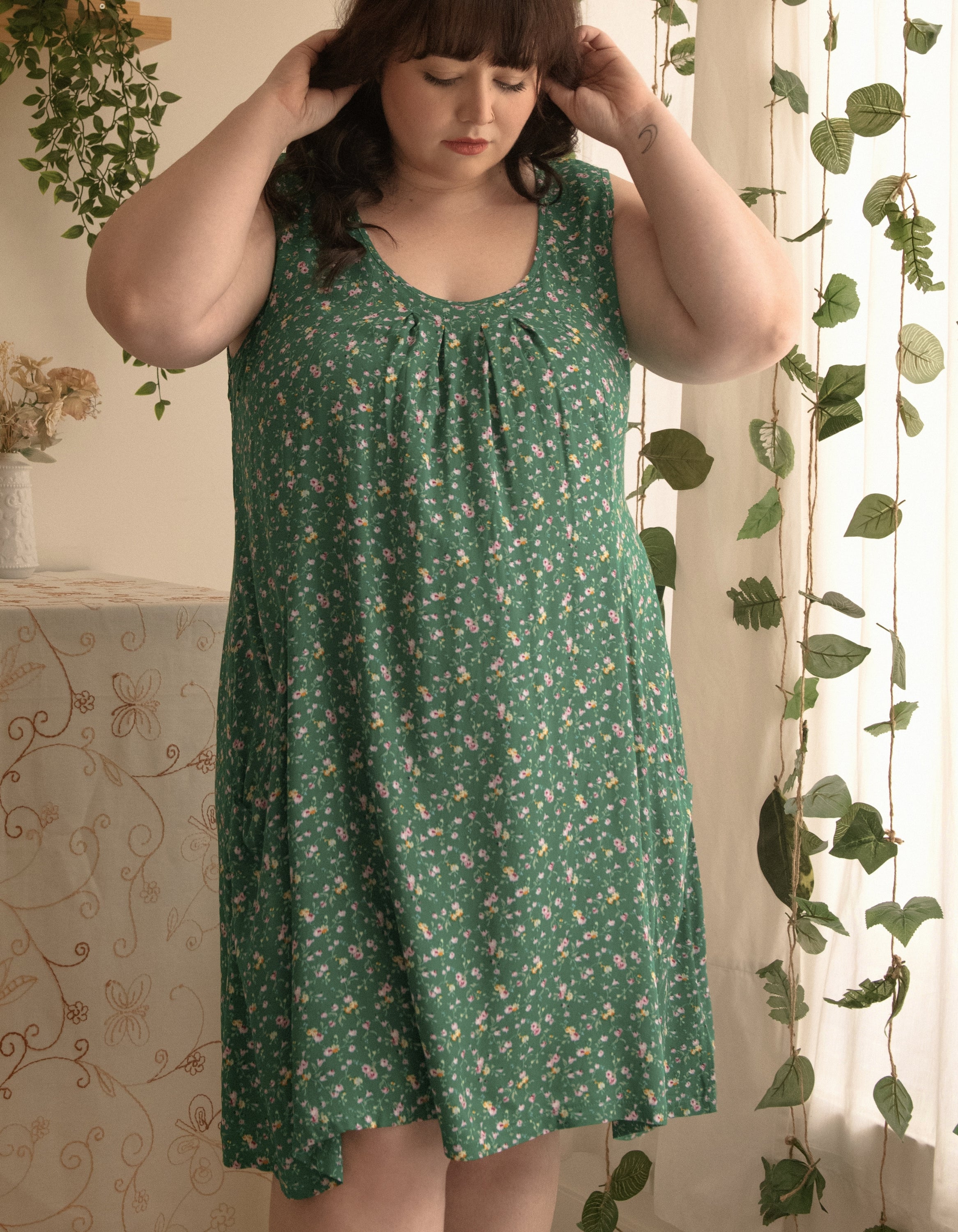 Louise Short Dress featuring a ditsy floral print in Navy, Red, and Green, showcasing a flattering A-line silhouette and side pockets.