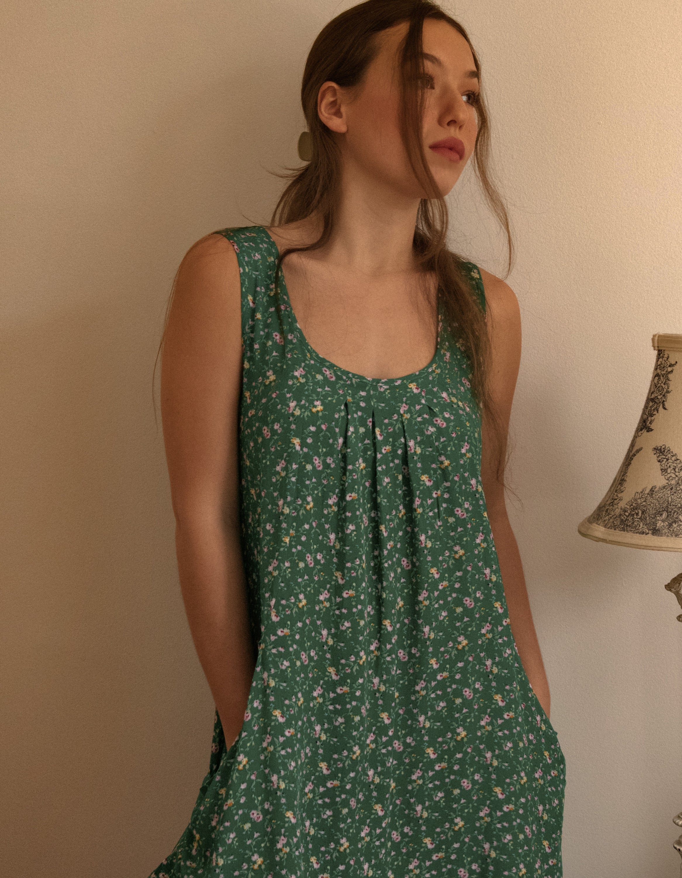 Louise Short Dress featuring a ditsy floral print in Navy, Red, and Green, showcasing a flattering A-line silhouette and side pockets.