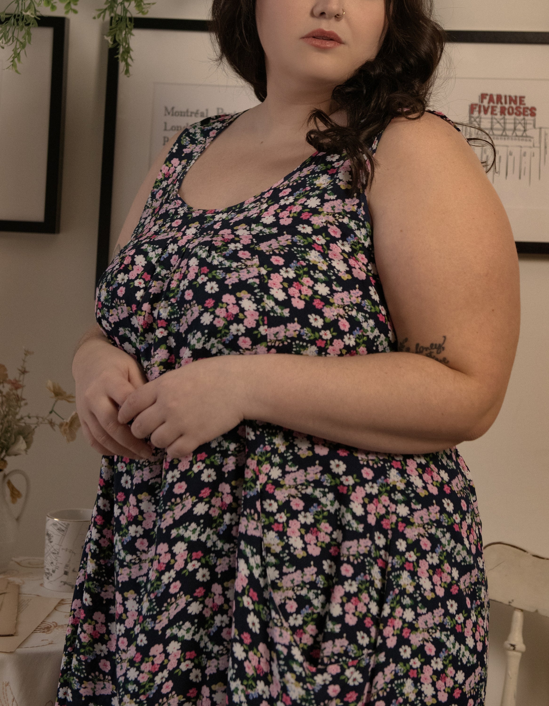 Louise Short Dress featuring a ditsy floral print in Navy, Red, and Green, showcasing a flattering A-line silhouette and side pockets.