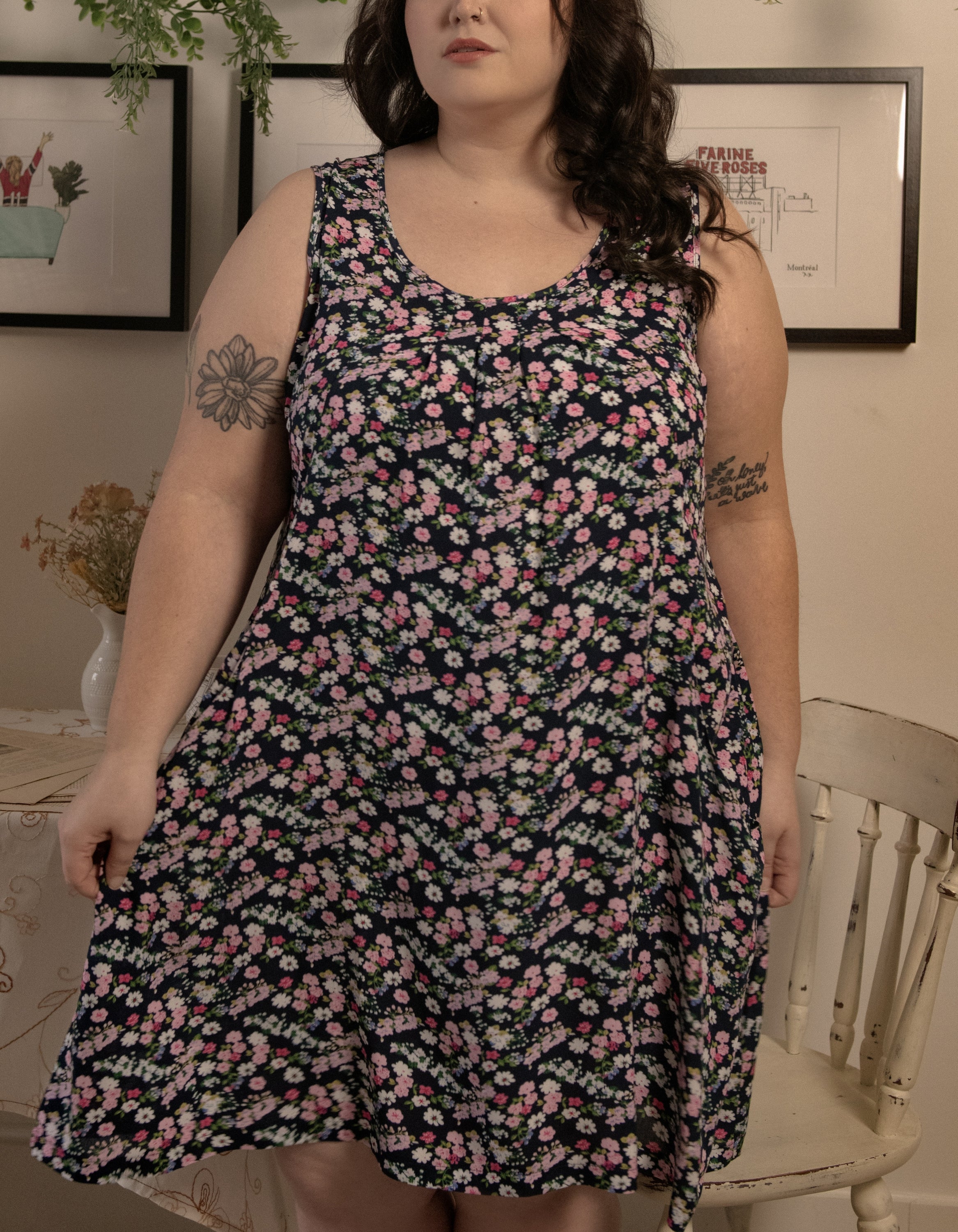 Louise Short Dress featuring a ditsy floral print in Navy, Red, and Green, showcasing a flattering A-line silhouette and side pockets.