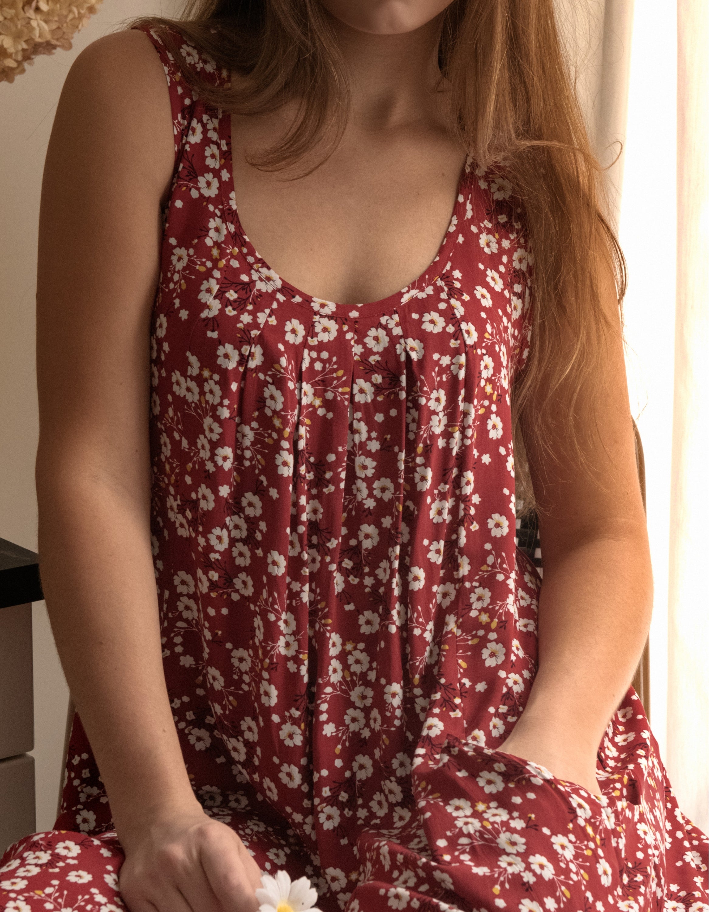 Louise Short Dress featuring a ditsy floral print in Navy, Red, and Green, showcasing a flattering A-line silhouette and side pockets.