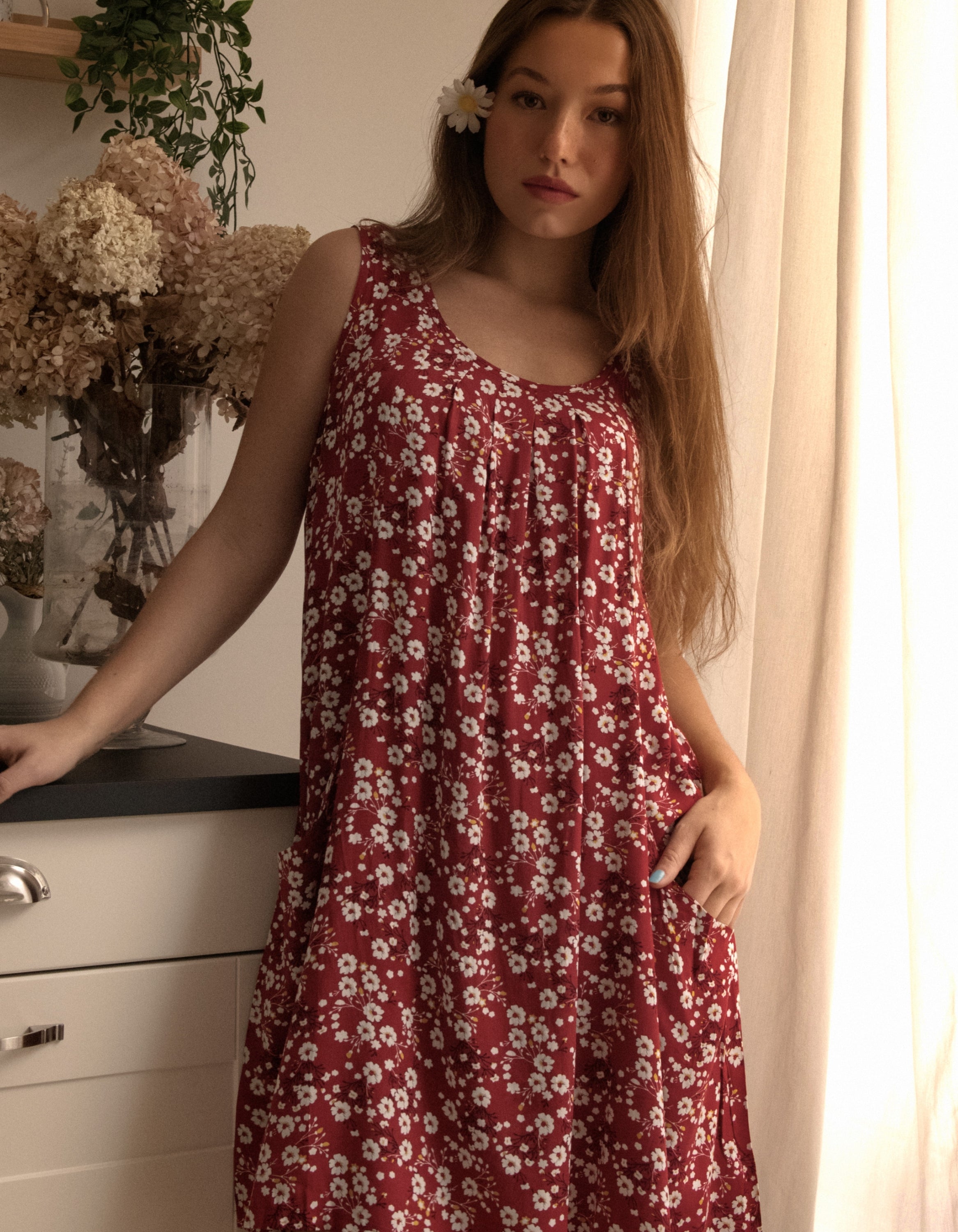 Louise Short Dress featuring a ditsy floral print in Navy, Red, and Green, showcasing a flattering A-line silhouette and side pockets.