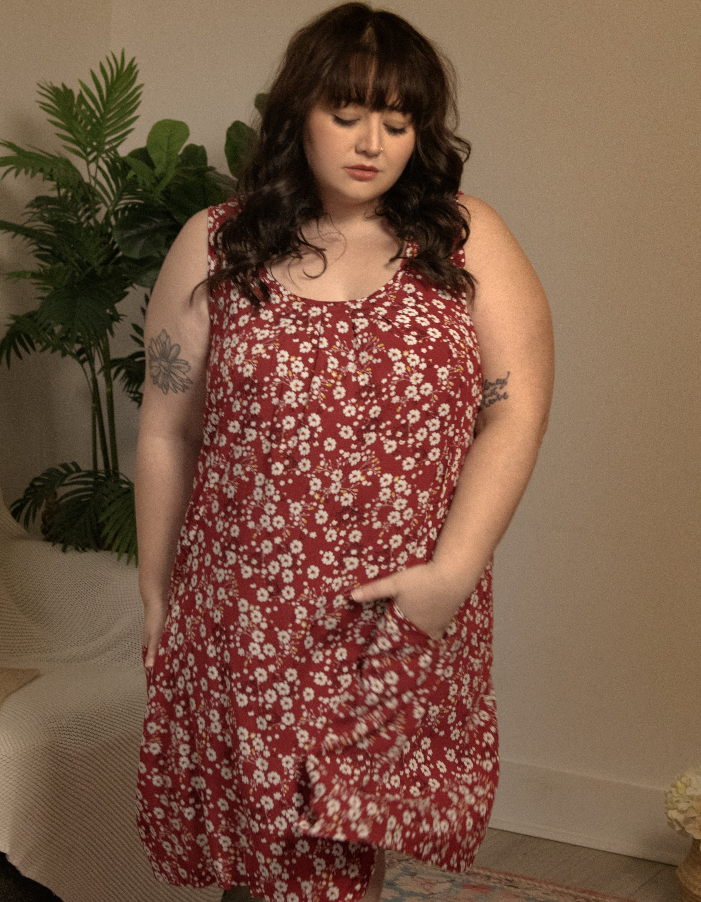 Louise Short Dress featuring a ditsy floral print in Navy, Red, and Green, showcasing a flattering A-line silhouette and side pockets.