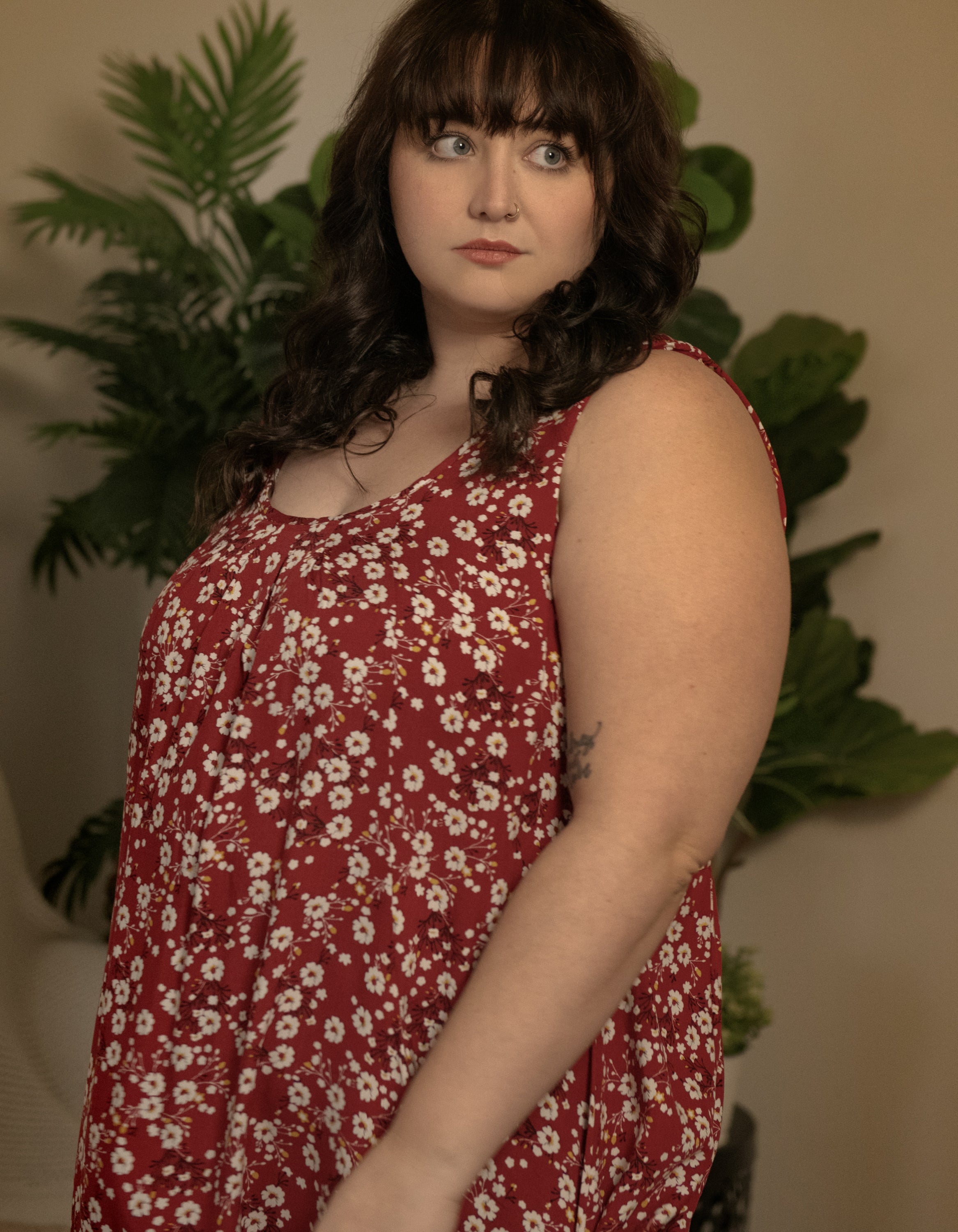 Louise Short Dress featuring a ditsy floral print in Navy, Red, and Green, showcasing a flattering A-line silhouette and side pockets.