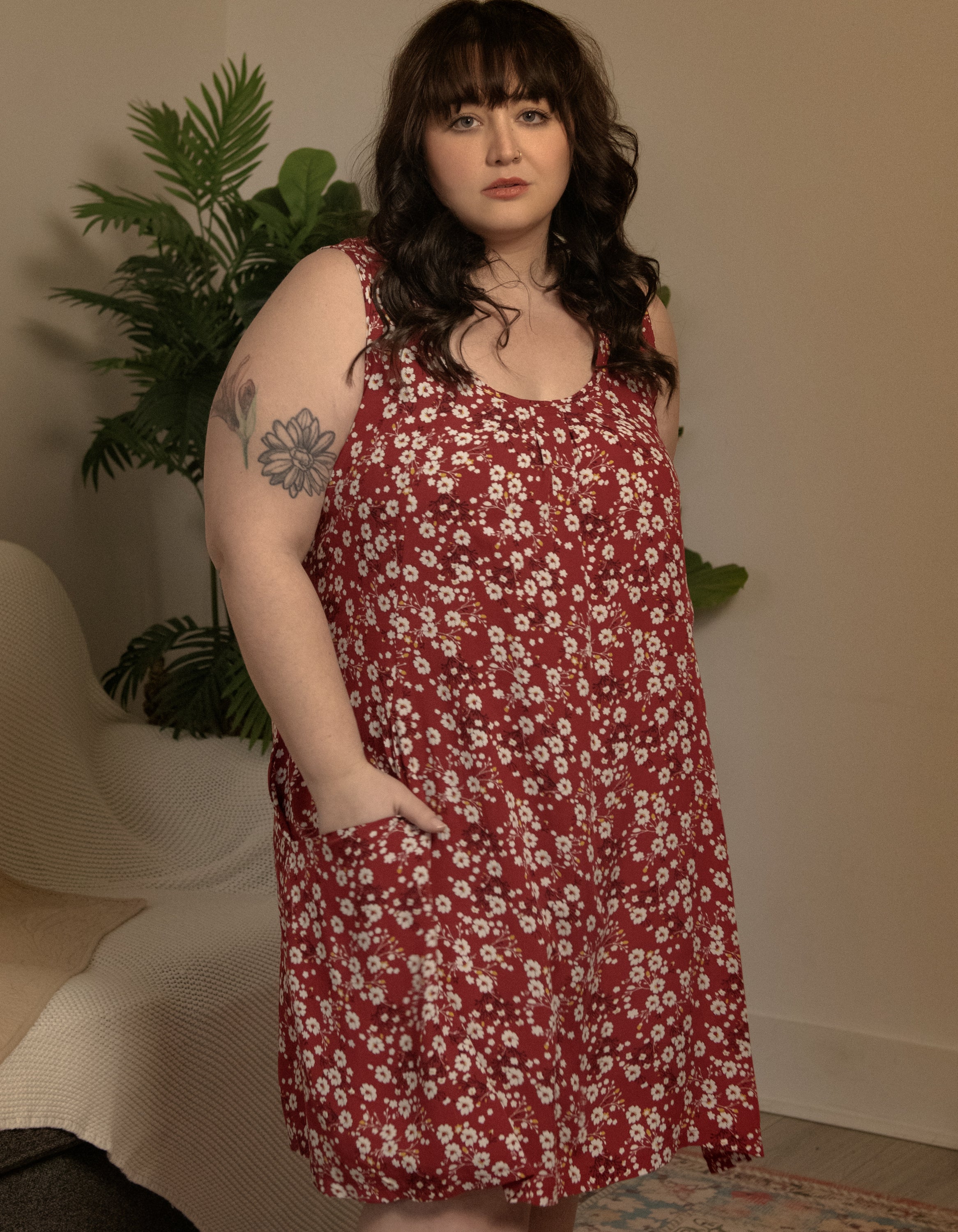 Louise Short Dress featuring a ditsy floral print in Navy, Red, and Green, showcasing a flattering A-line silhouette and side pockets.