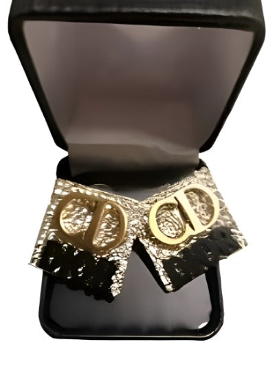 Lux Earrings featuring a stylish gold and black design, perfect for any occasion.