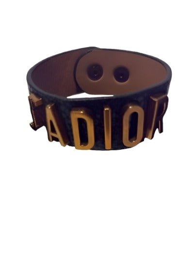 Lux Women Bracelet by Dior in gold and dark gold genuine leather, showcasing elegant design and high-quality craftsmanship.