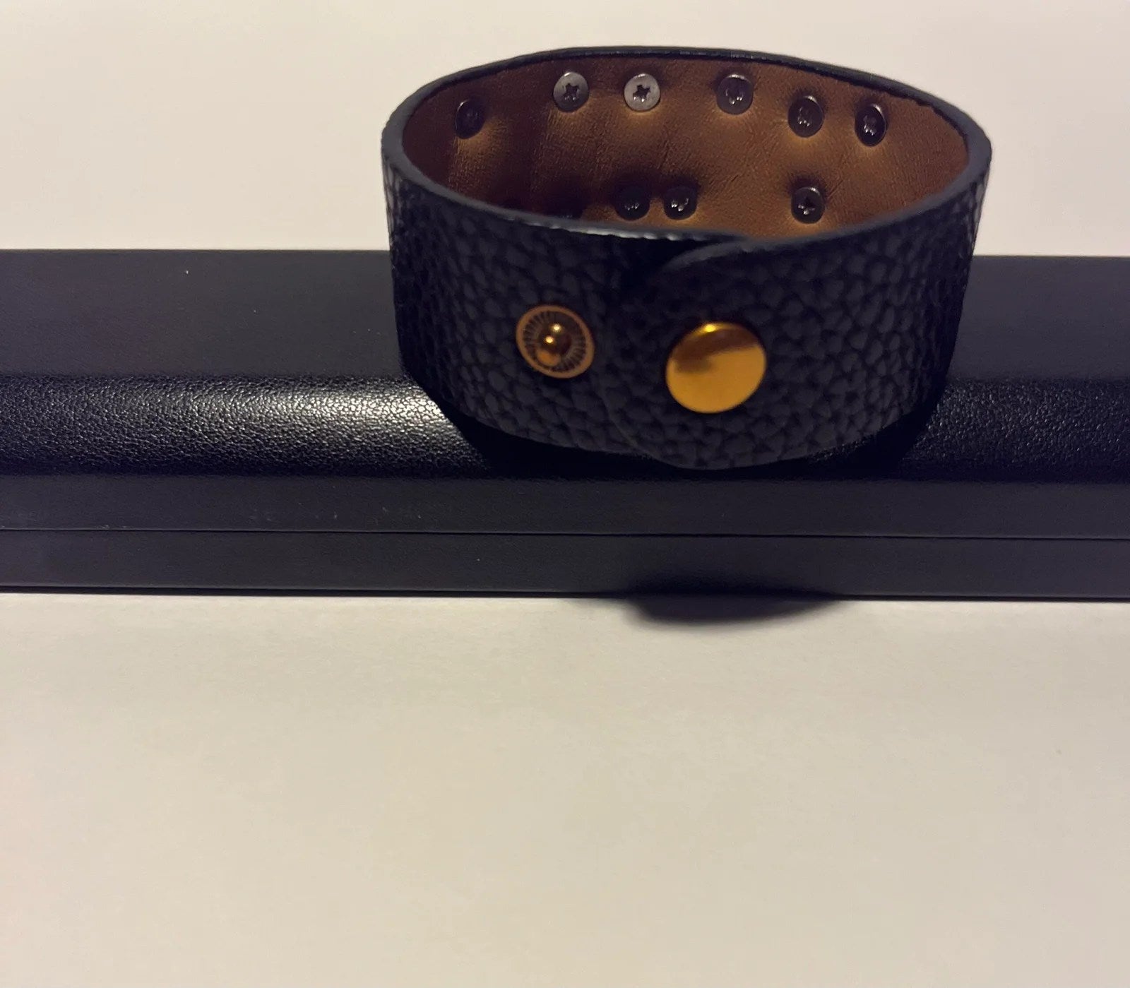 Lux Women Bracelet by Dior in gold and dark gold genuine leather, showcasing elegant design and high-quality craftsmanship.