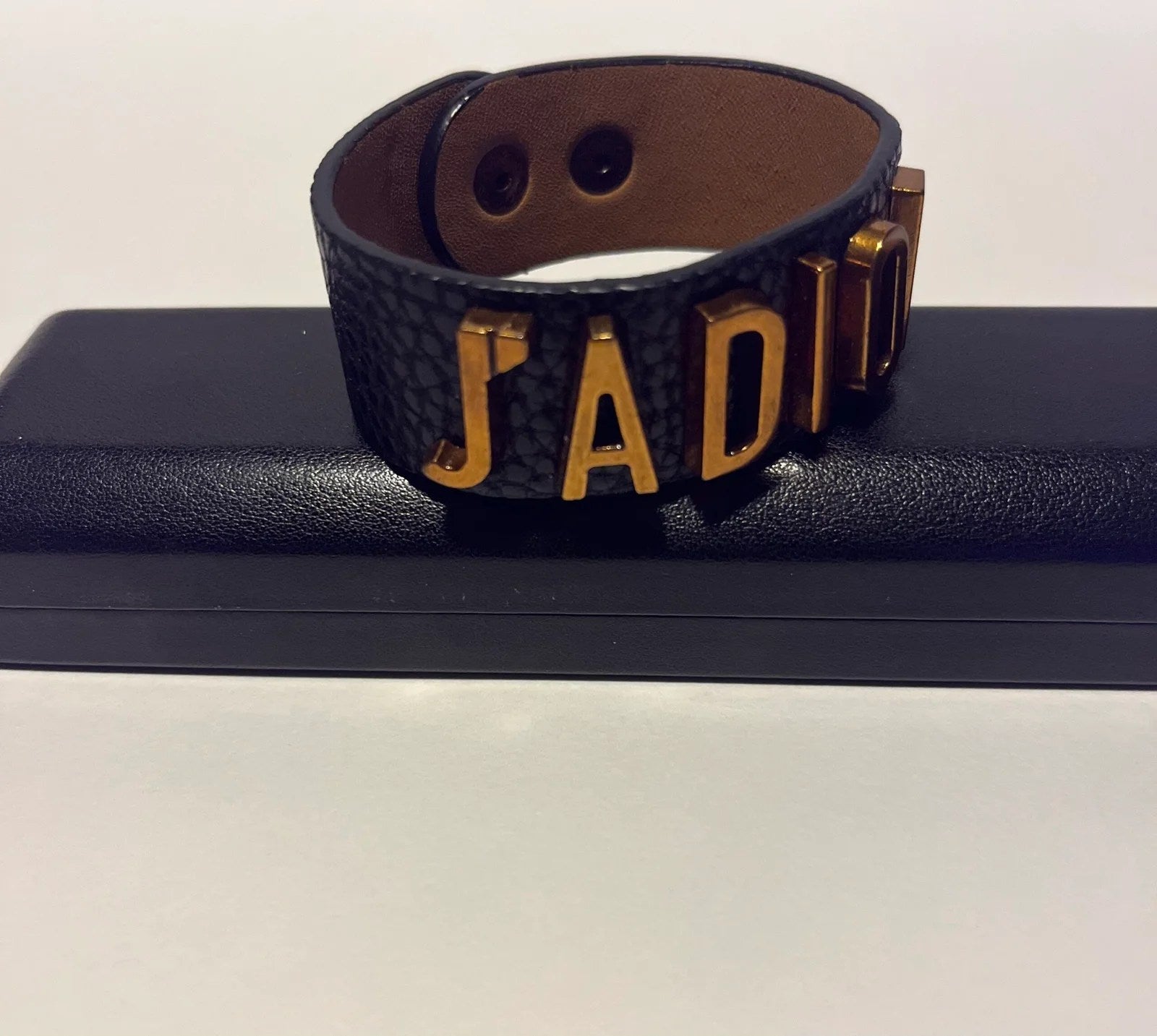 Lux Women Bracelet by Dior in gold and dark gold genuine leather, showcasing elegant design and high-quality craftsmanship.