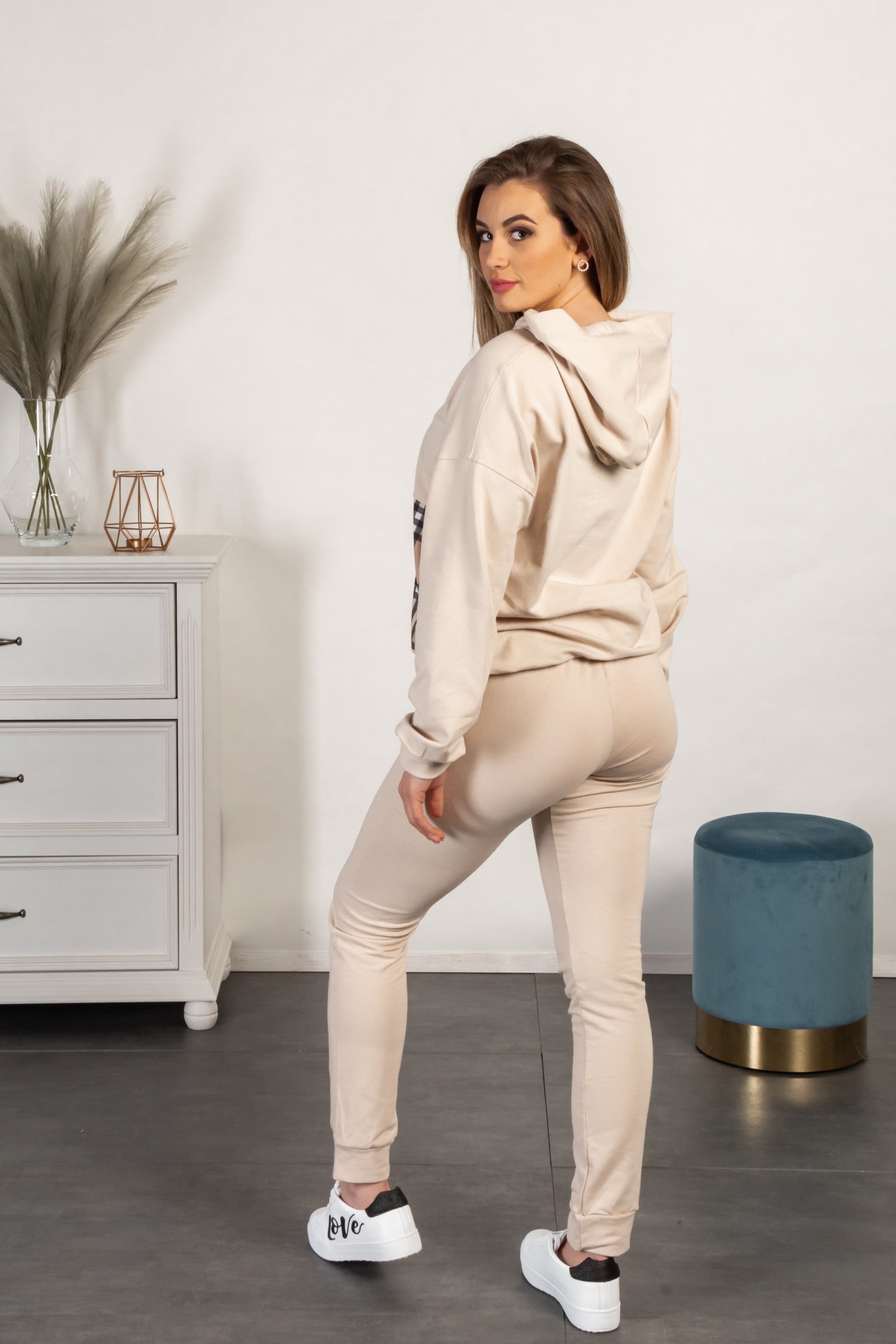 Madelina beige check print cotton tracksuit set featuring a plaid sweatshirt with a hood and long pants with an elastic waist and side pockets.