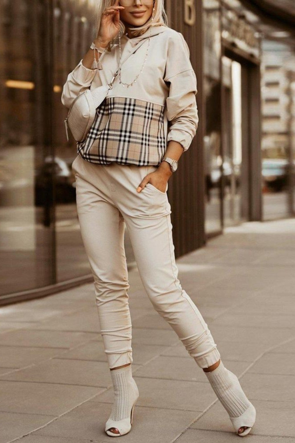 Madelina beige check print cotton tracksuit set featuring a plaid sweatshirt with a hood and long pants with an elastic waist.