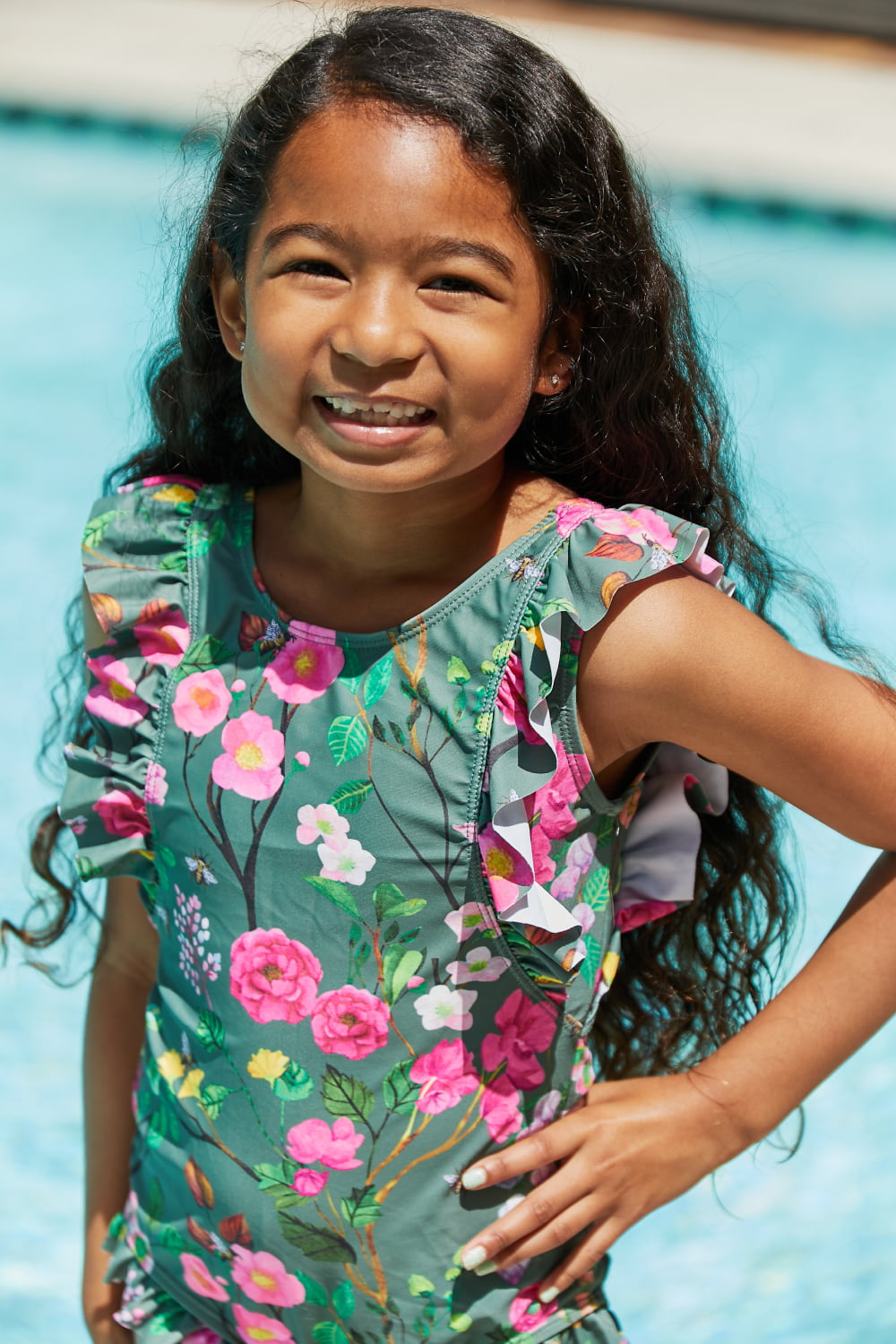 Marina West Bring Me Flowers V-Neck One Piece Swimsuit in Sage with floral ruffle design, perfect for beach outings.