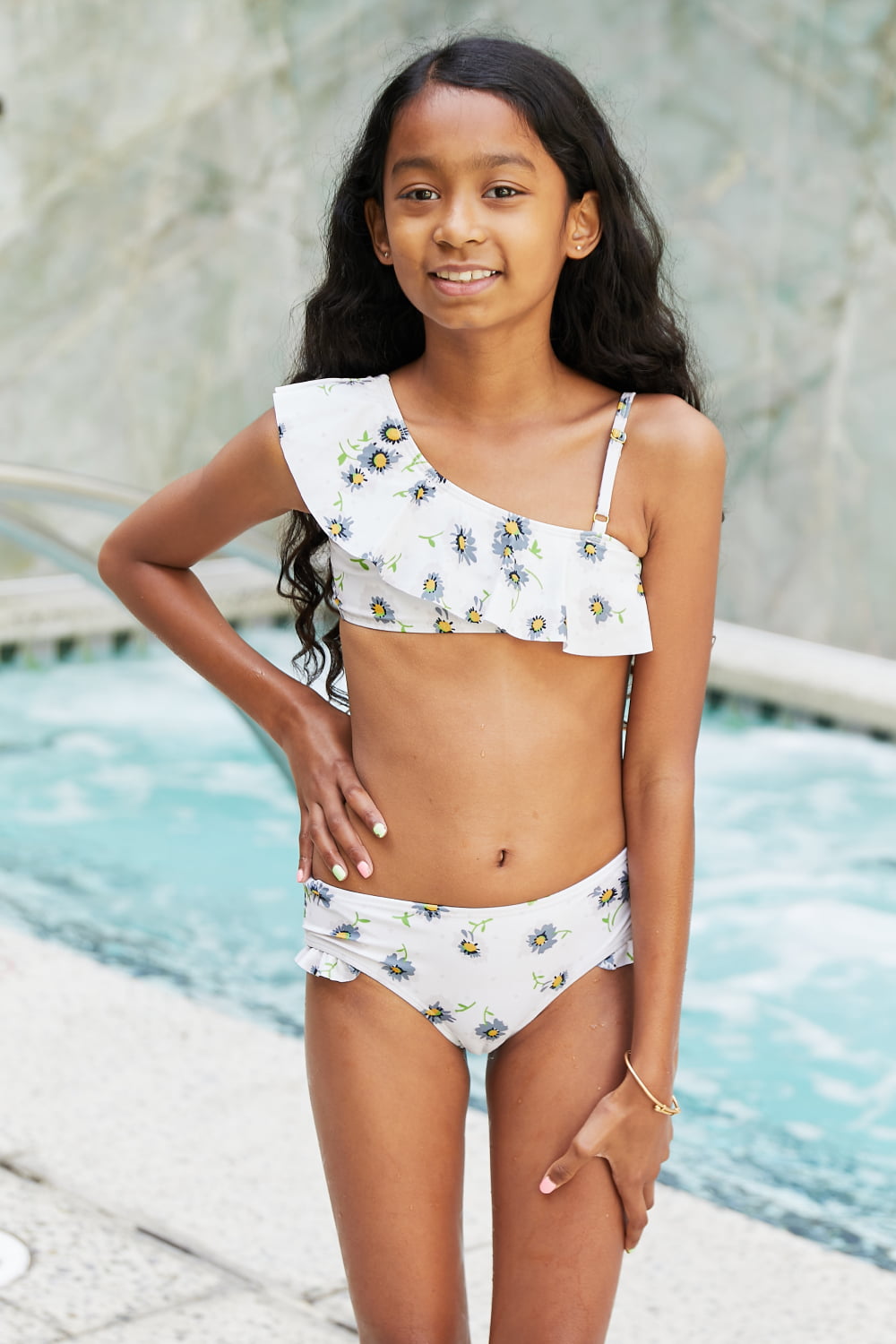 Marina West Swim Float On Asymmetric Neck Two-Piece Set in Daisy Cream featuring floral pattern and ruffled design.