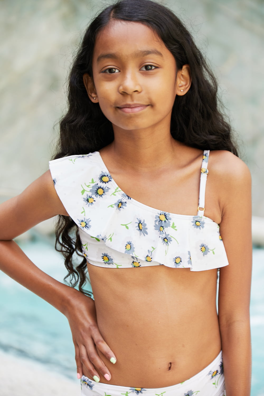 Marina West Swim Float On Asymmetric Neck Two-Piece Set in Daisy Cream featuring floral pattern and ruffled design.