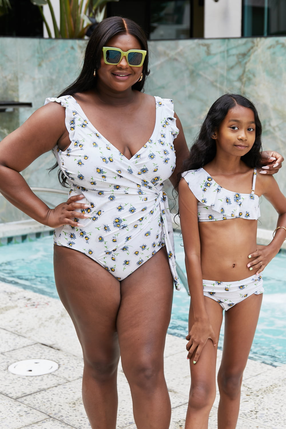 Marina West Swim Float On Asymmetric Neck Two-Piece Set in Daisy Cream featuring floral pattern and ruffled design.