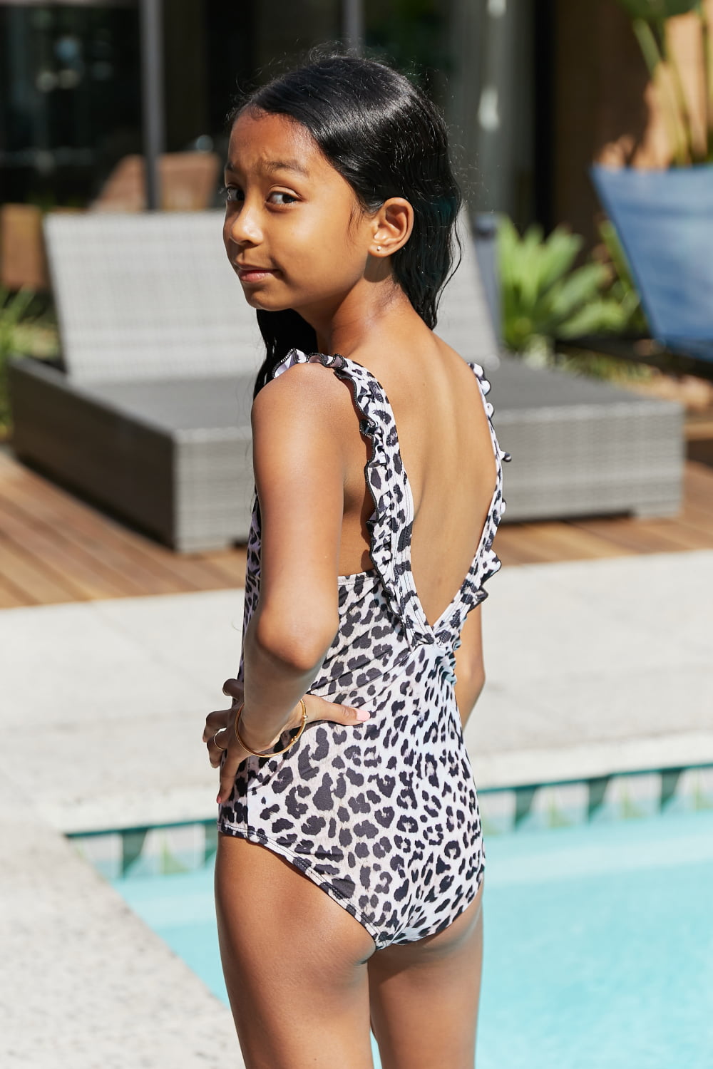 Marina West Swim Float On Ruffled One-Piece in Cat featuring leopard print and ruffle detailing, perfect for beach and pool activities.