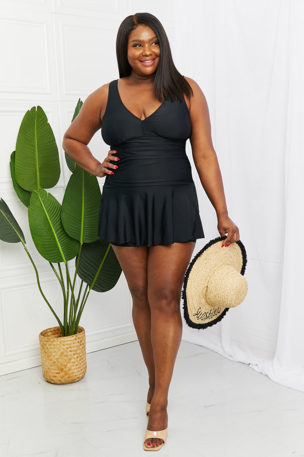 Marina West Swim Full Size Clear Waters Swim Dress in Black featuring a flared cut and built-in boyshorts, perfect for stylish swim days.