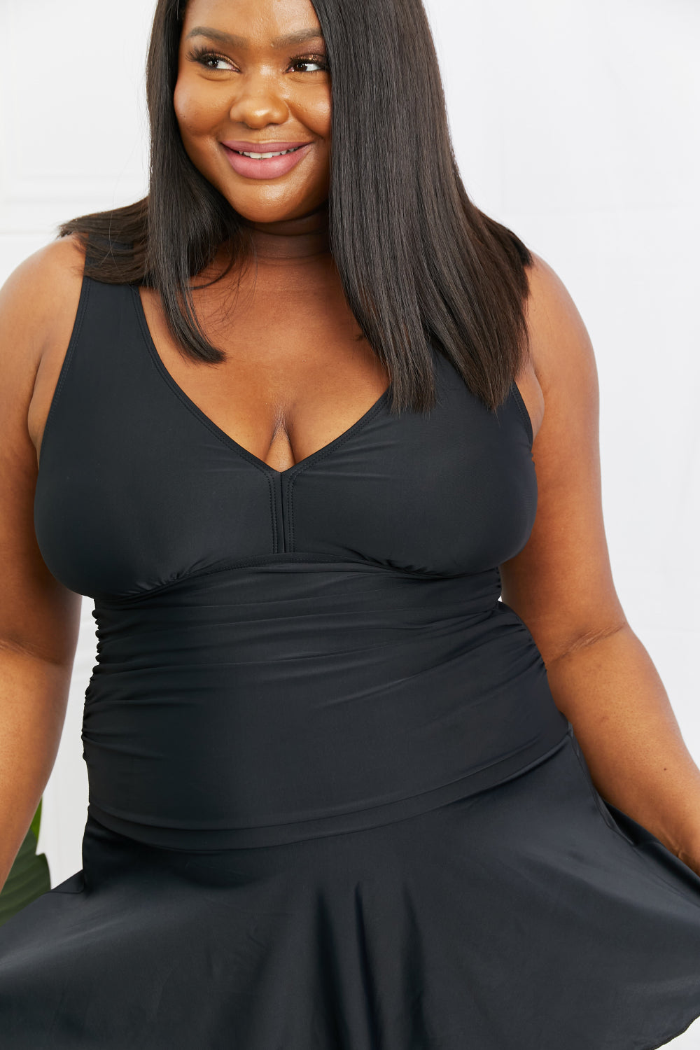 Marina West Swim Full Size Clear Waters Swim Dress in Black featuring a flared cut and built-in boyshorts, perfect for stylish swim days.