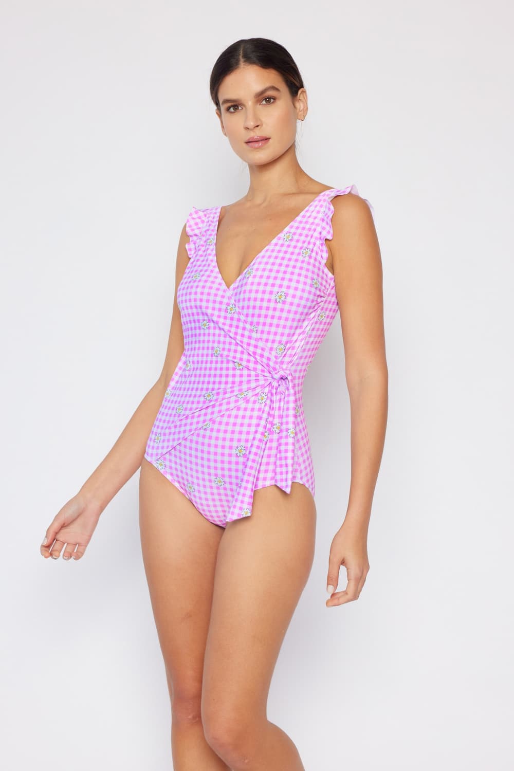 Marina West Swim Full Size Float On Ruffle Faux Wrap One-Piece swimsuit featuring ruffle details and floral patterns.