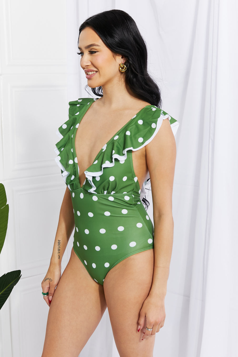 Marina West Swim Moonlit Dip Ruffle Plunge Swimsuit in Mid Green featuring a deep plunge neckline and ruffle trim, perfect for beach outings.
