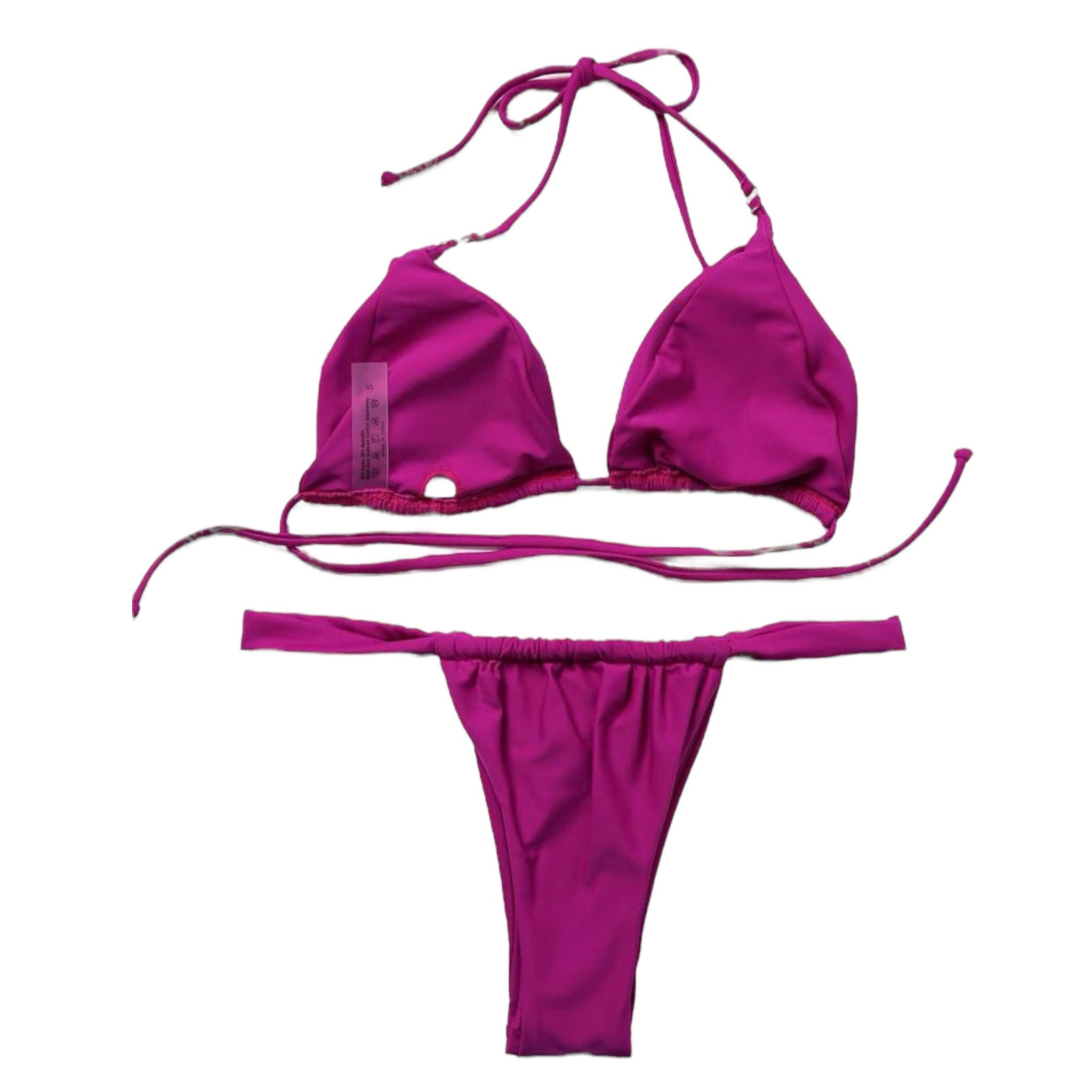 Mauve two piece swimsuit featuring a halter neck and tie back design, perfect for stylish beach outings.